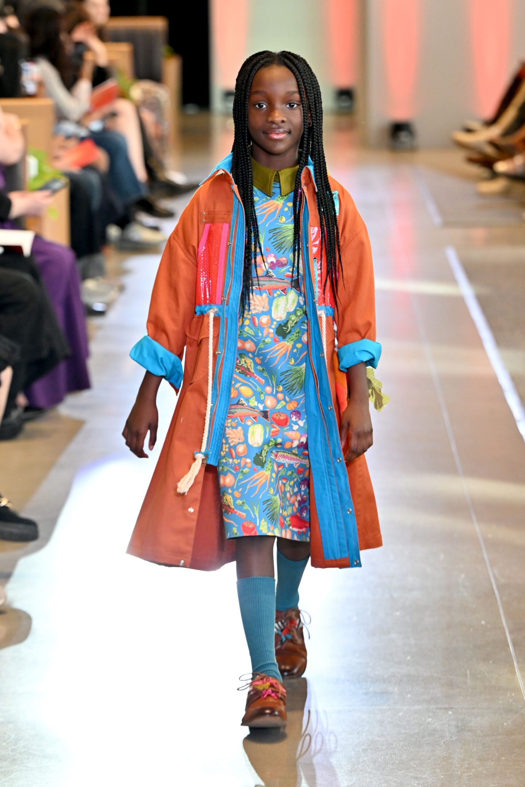 brown coat over colorful dress