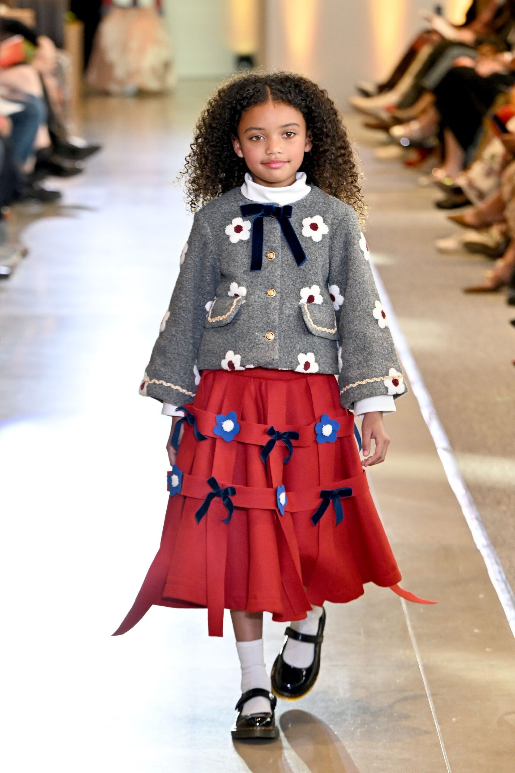 gray embroidered jacket red skirt