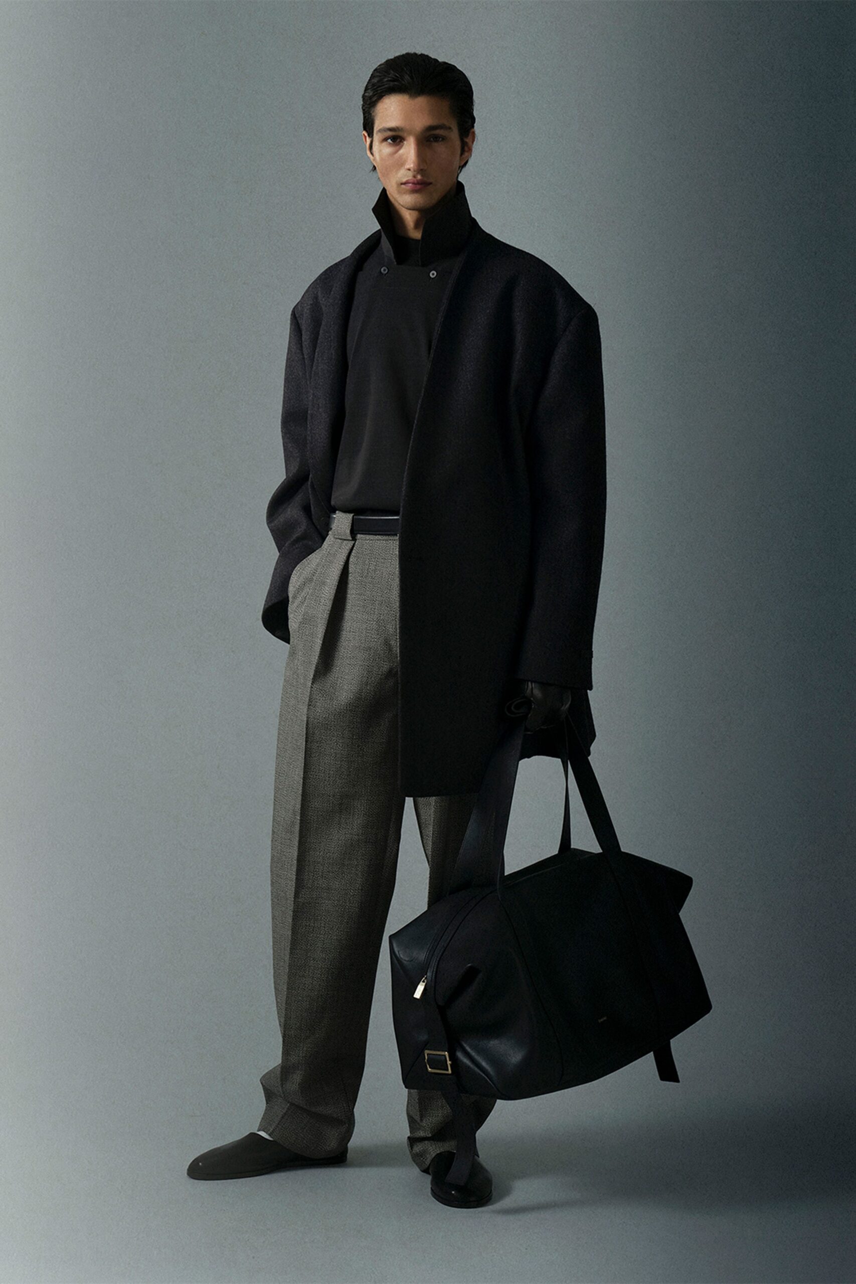 black oversized coat with gray tailored pants