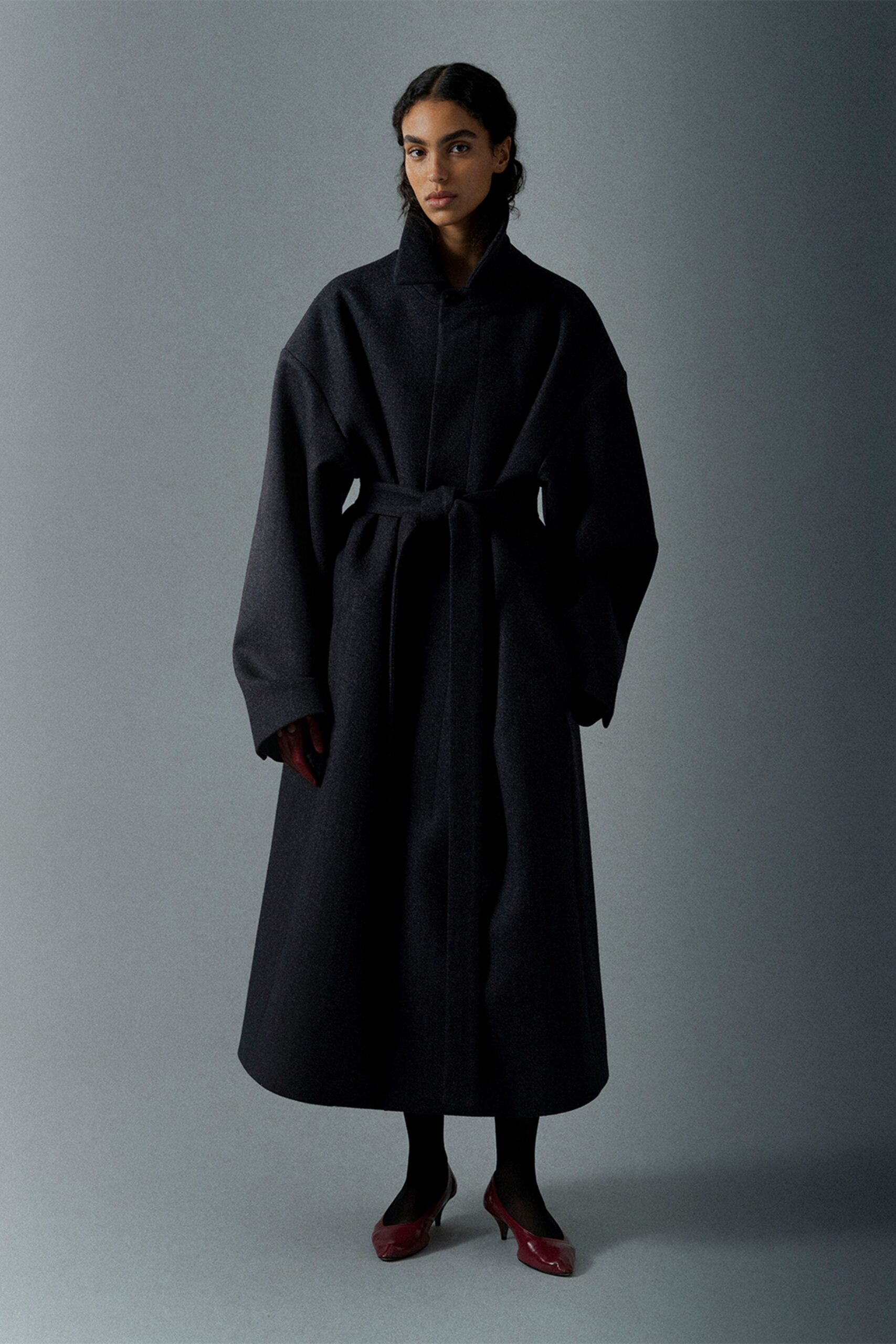 black wool long-sleeve collared oversized belted midi coat