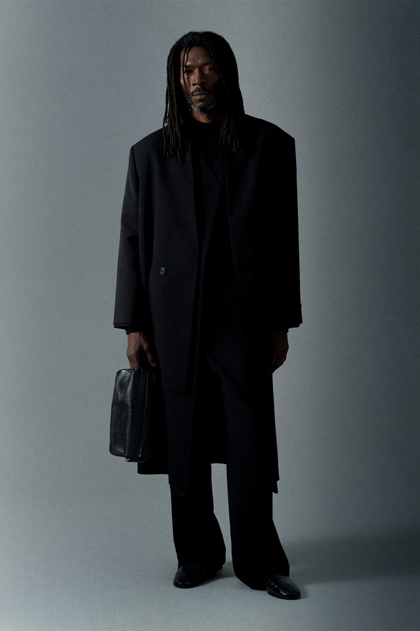 black wool long-sleeve collared oversized buttoned coat
