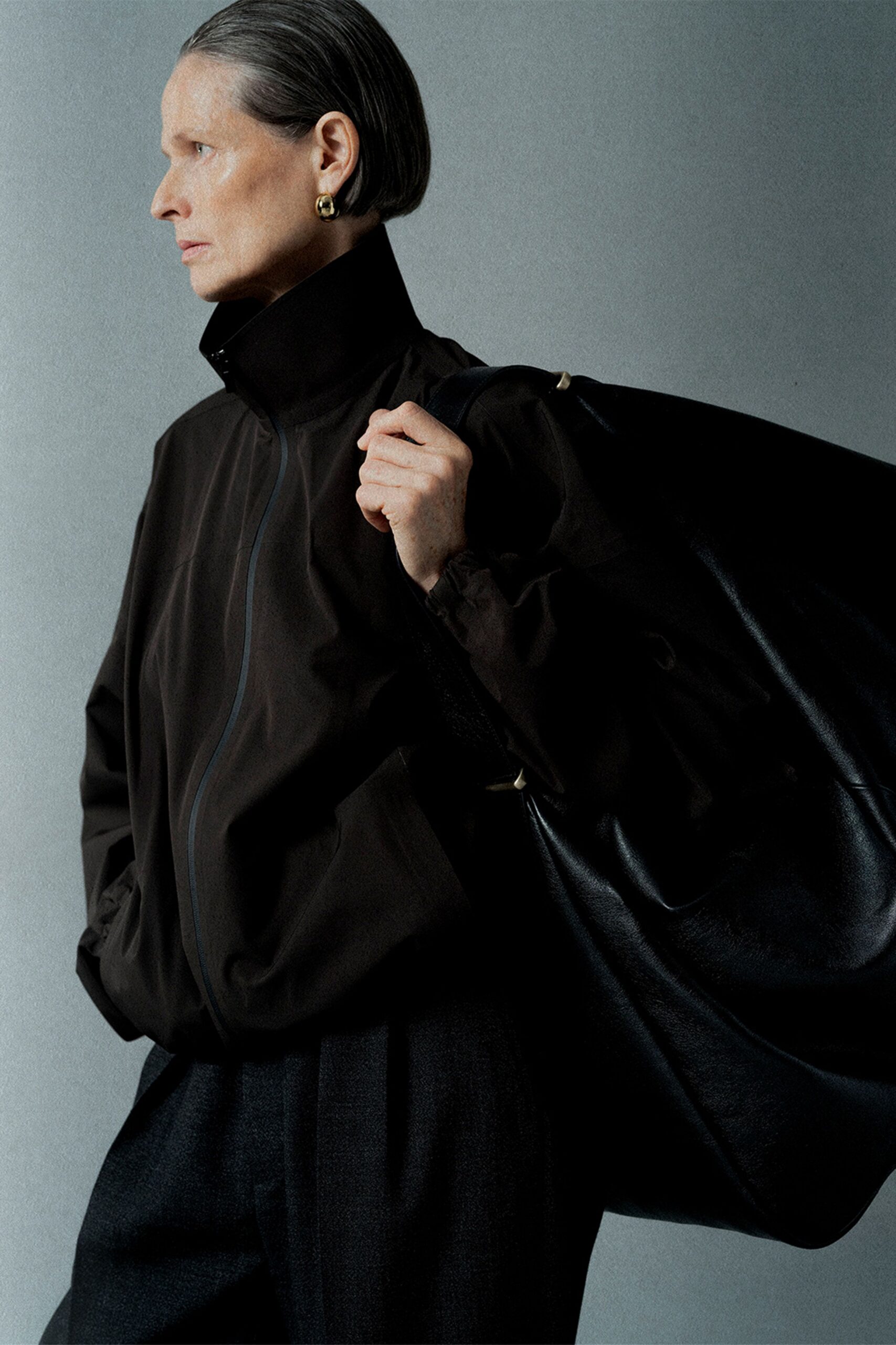 black relaxed jacket with gray pants