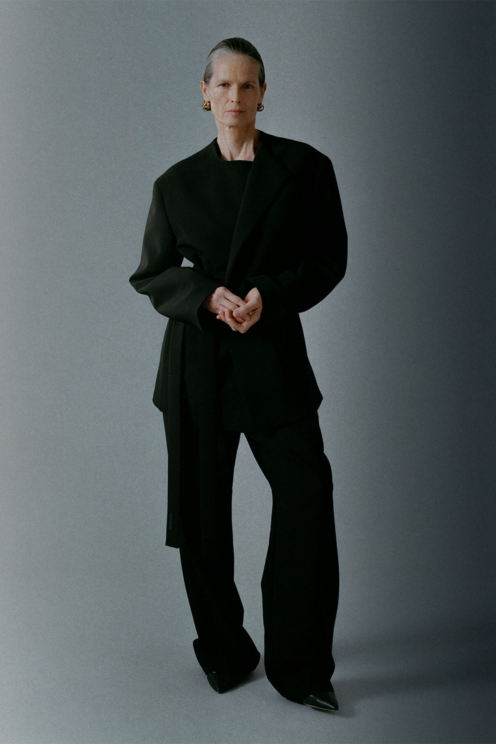 black structured blazer and relaxed pants