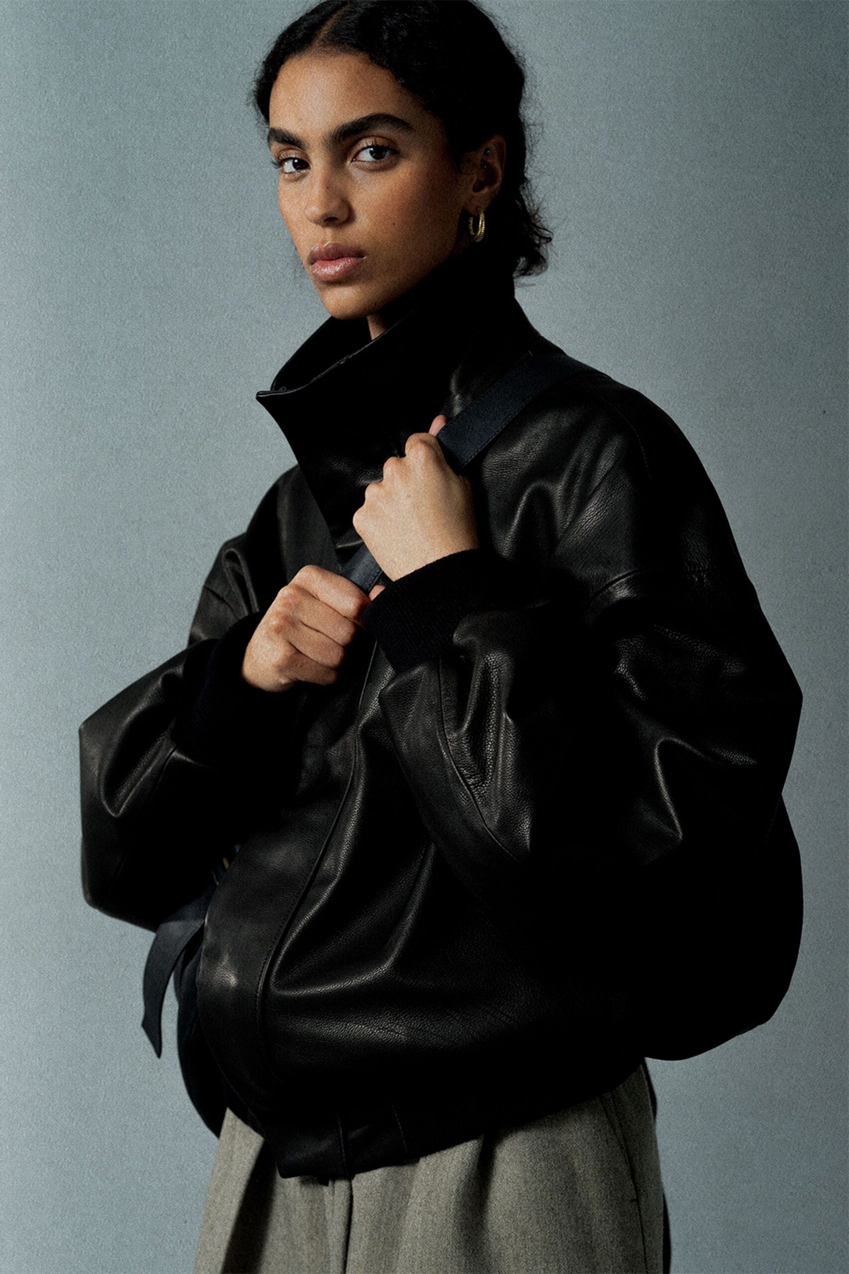 black leather long-sleeve collared oversized jacket