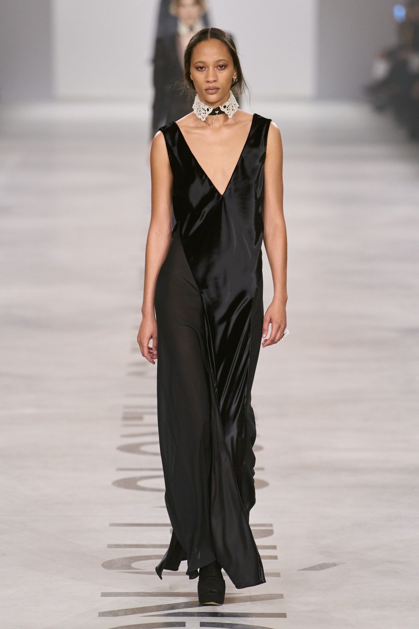 black silk sleeveless v-neck fitted draped flowing gown