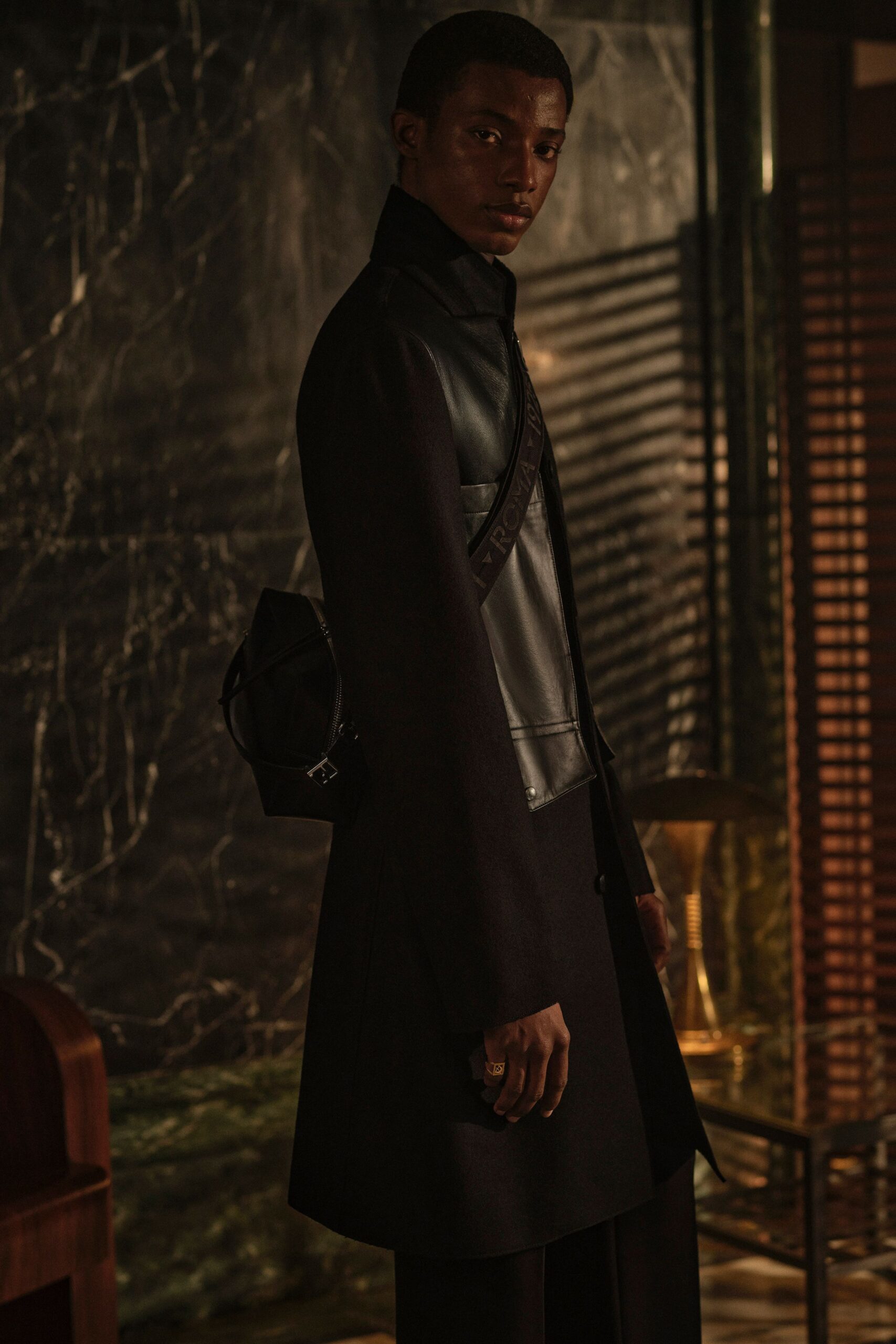 black leather sleeveless high-neck fitted top
