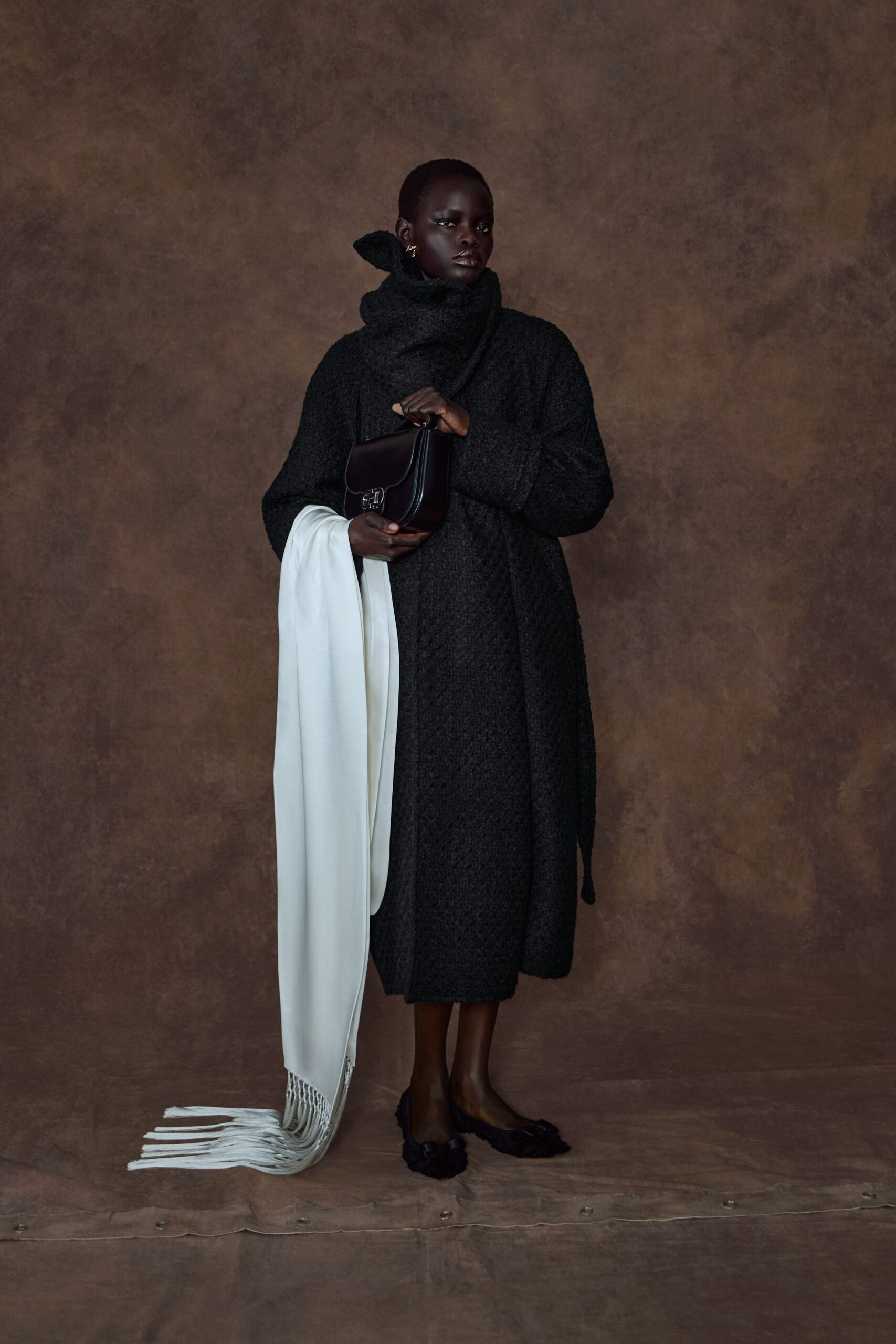 black wool long-sleeve collared relaxed textured midi coat