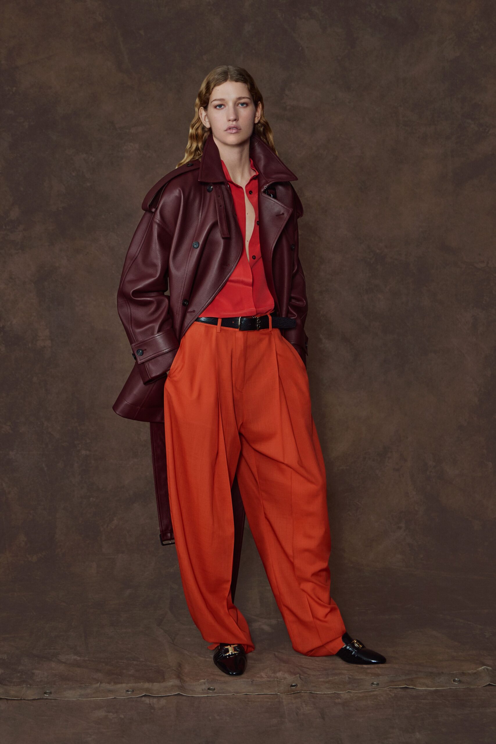 maroon leather long-sleeve collared relaxed buttoned coat