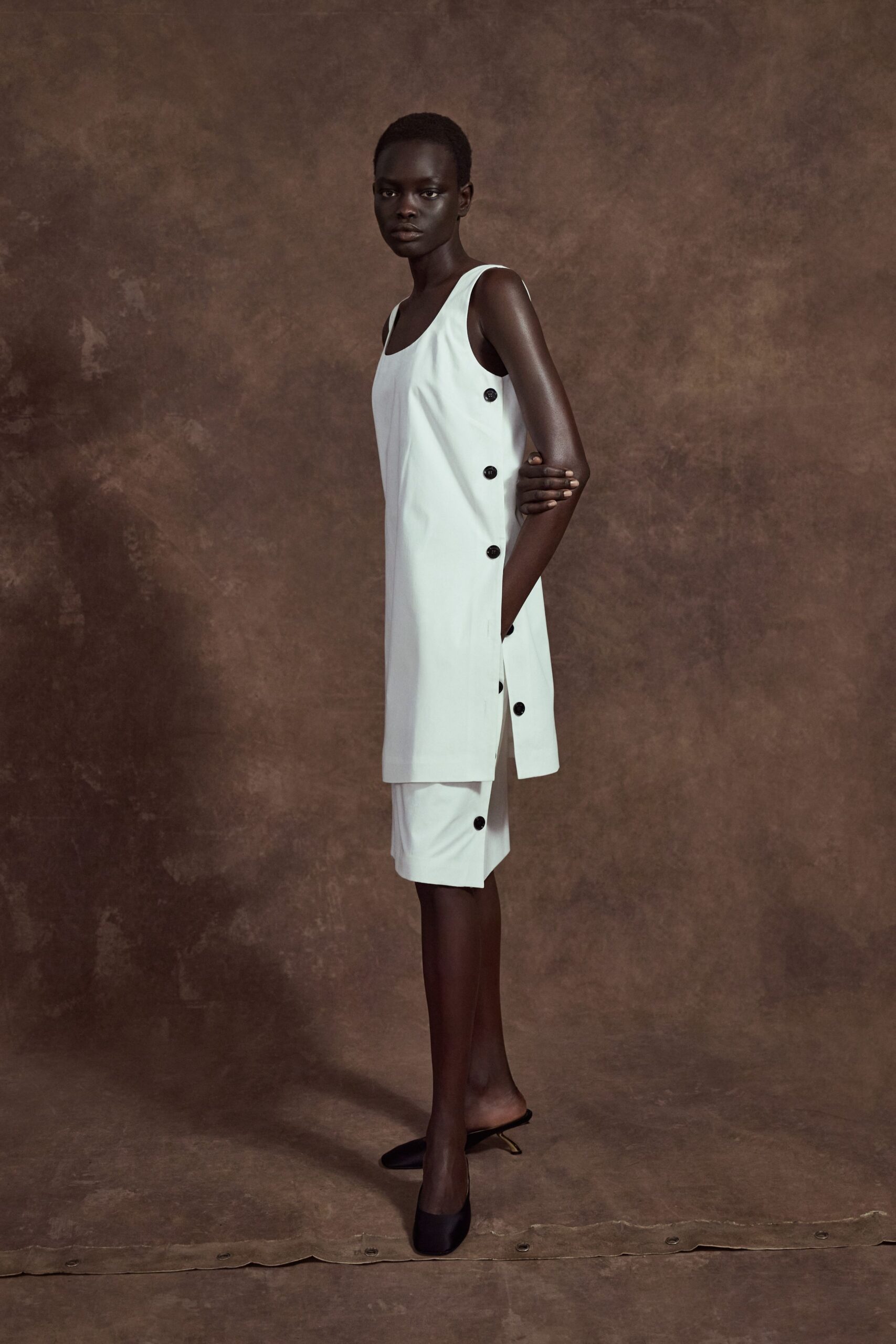 white cotton sleeveless collared fitted buttoned mini dress