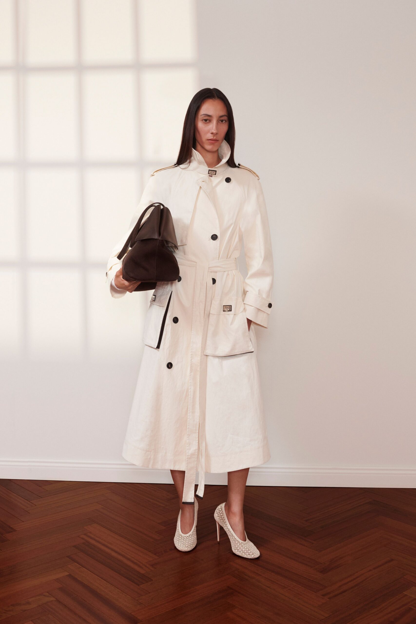 white cotton long-sleeve collared relaxed buttoned belted trench