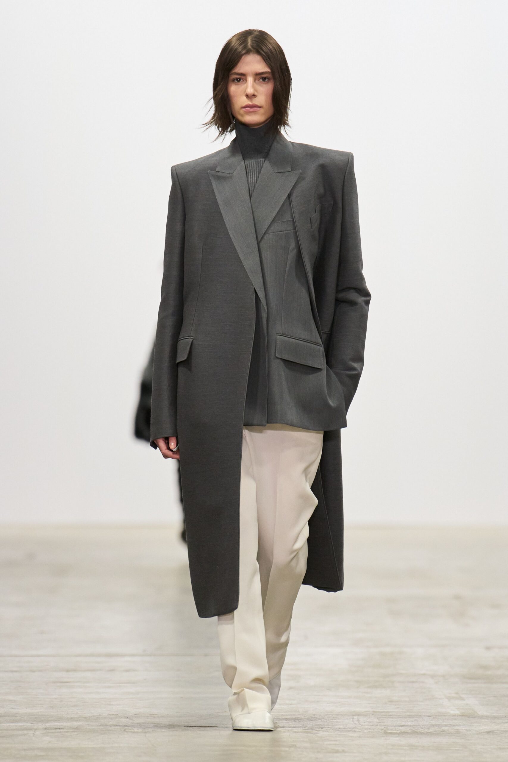 gray blazer with white pants