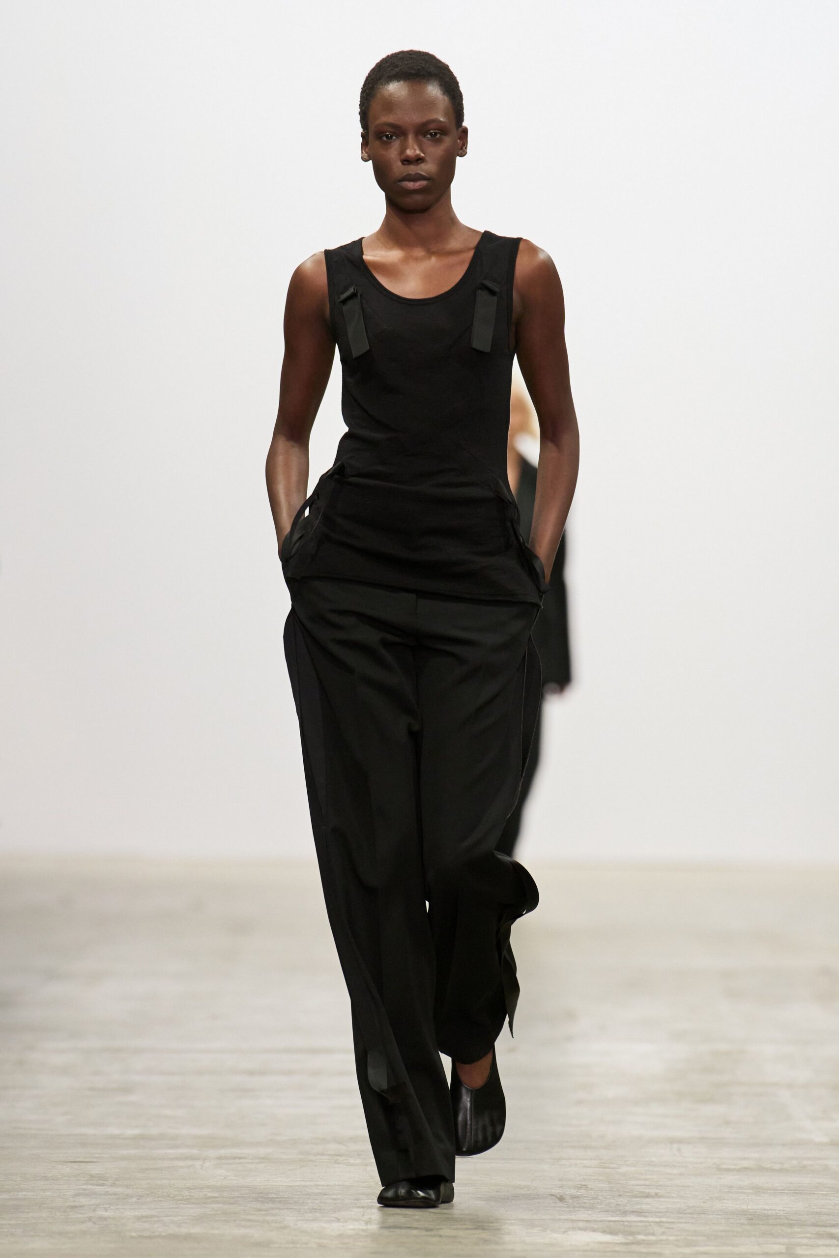 black fitted jumpsuit with relaxed pants