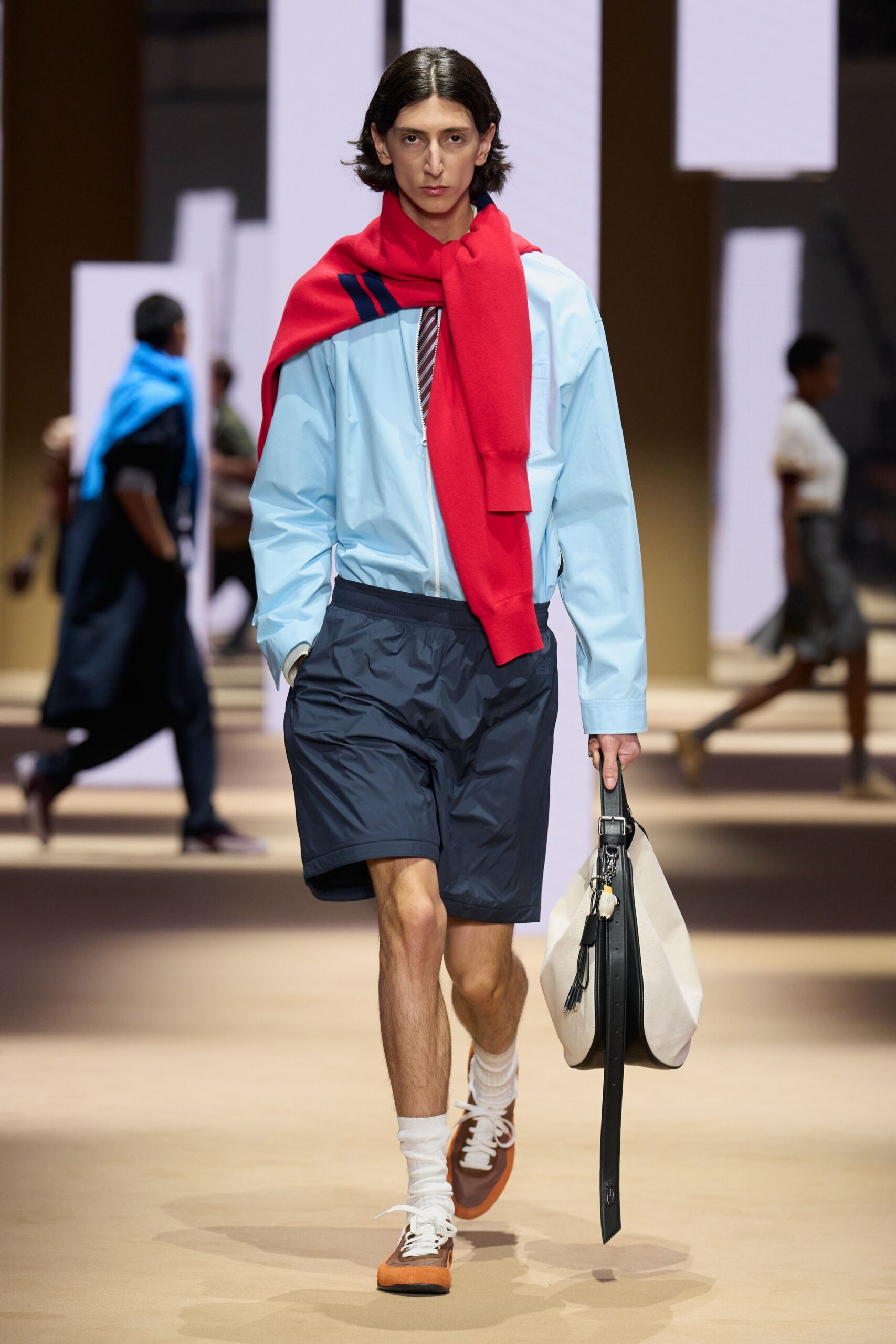 light blue jacket with red sweater