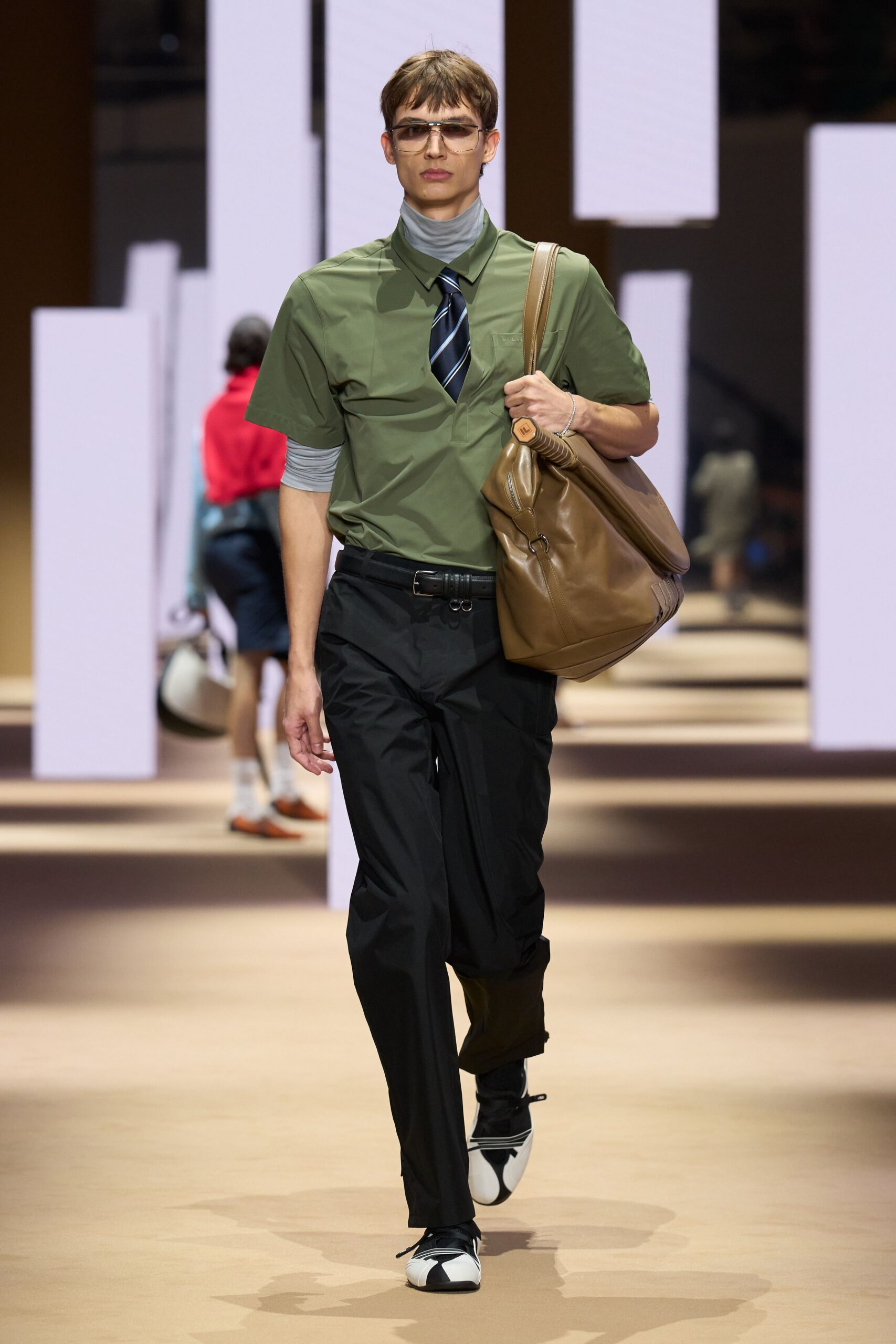 green fitted shirt with black pants