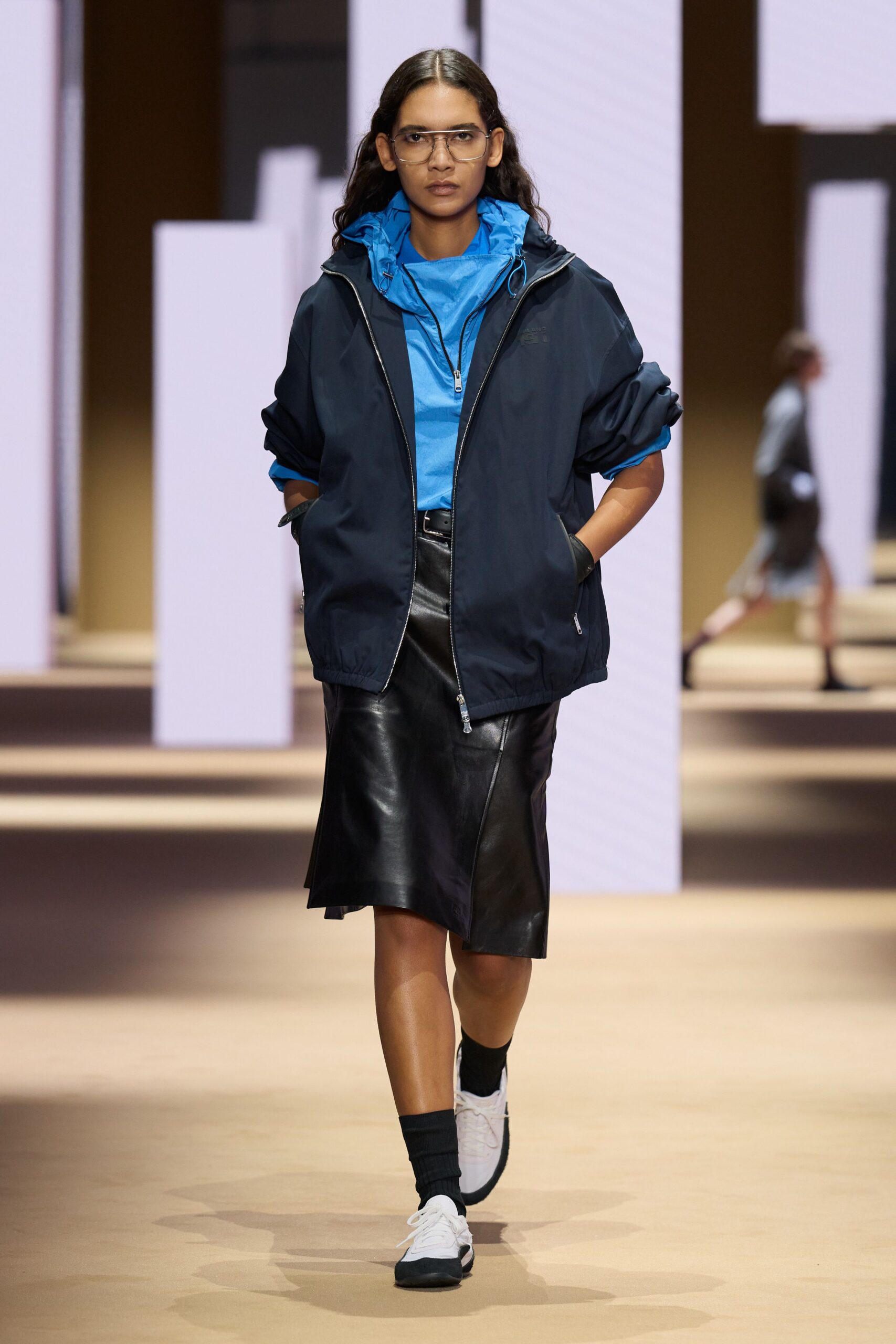 black jacket blue top leather skirt