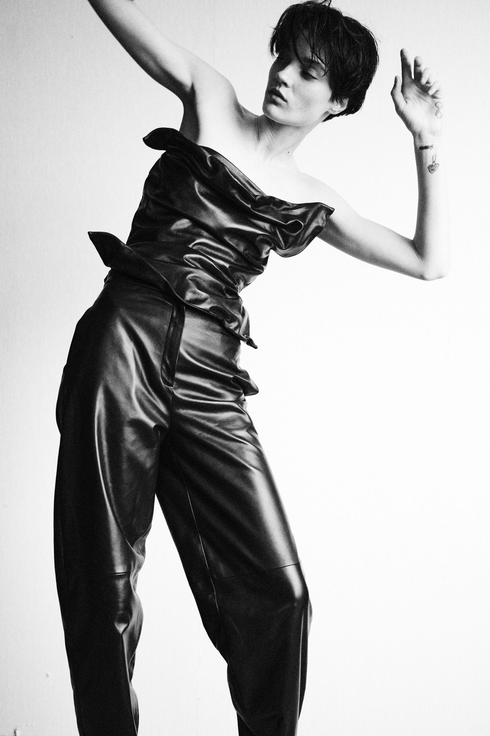 black leather sleeveless off-shoulder fitted draped top