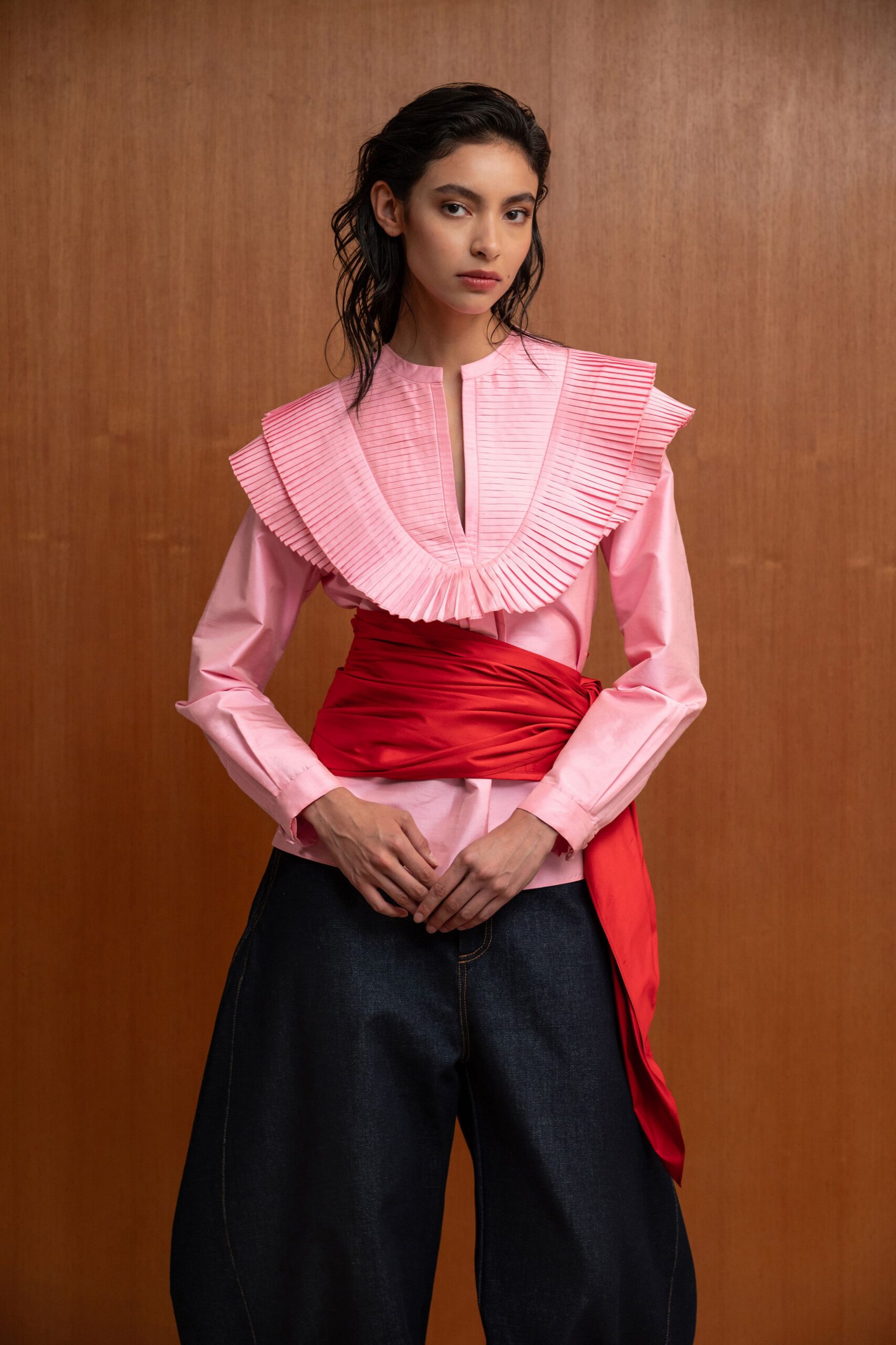 pink collared shirt with red belt