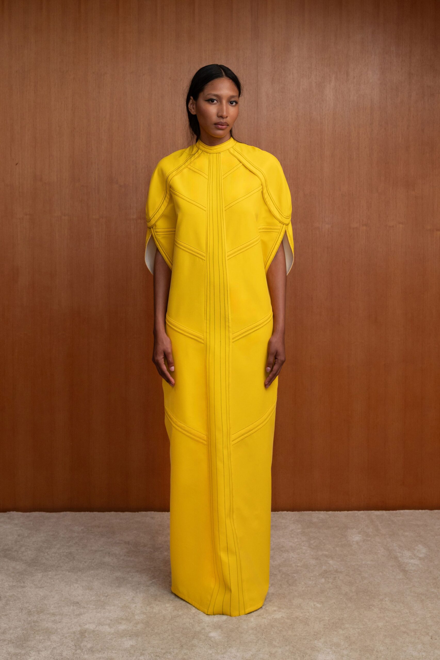 fitted yellow long-sleeve gown