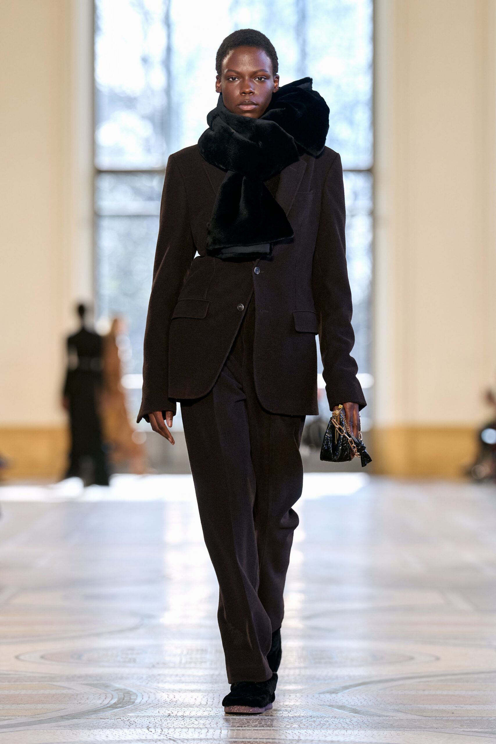 black tailored suit with faux-fur scarf