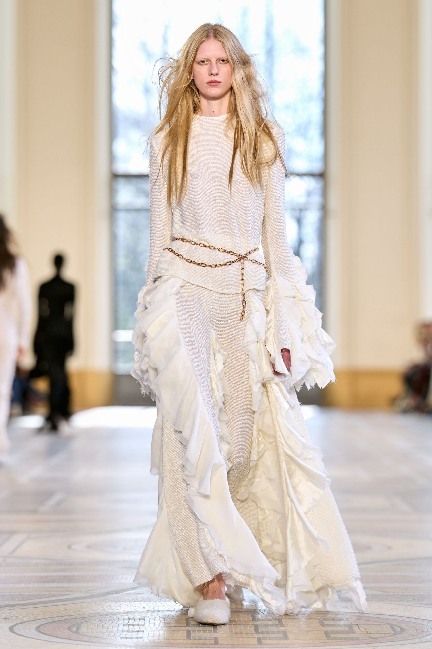 white silk long-sleeve fitted ruffled layered flowing gown