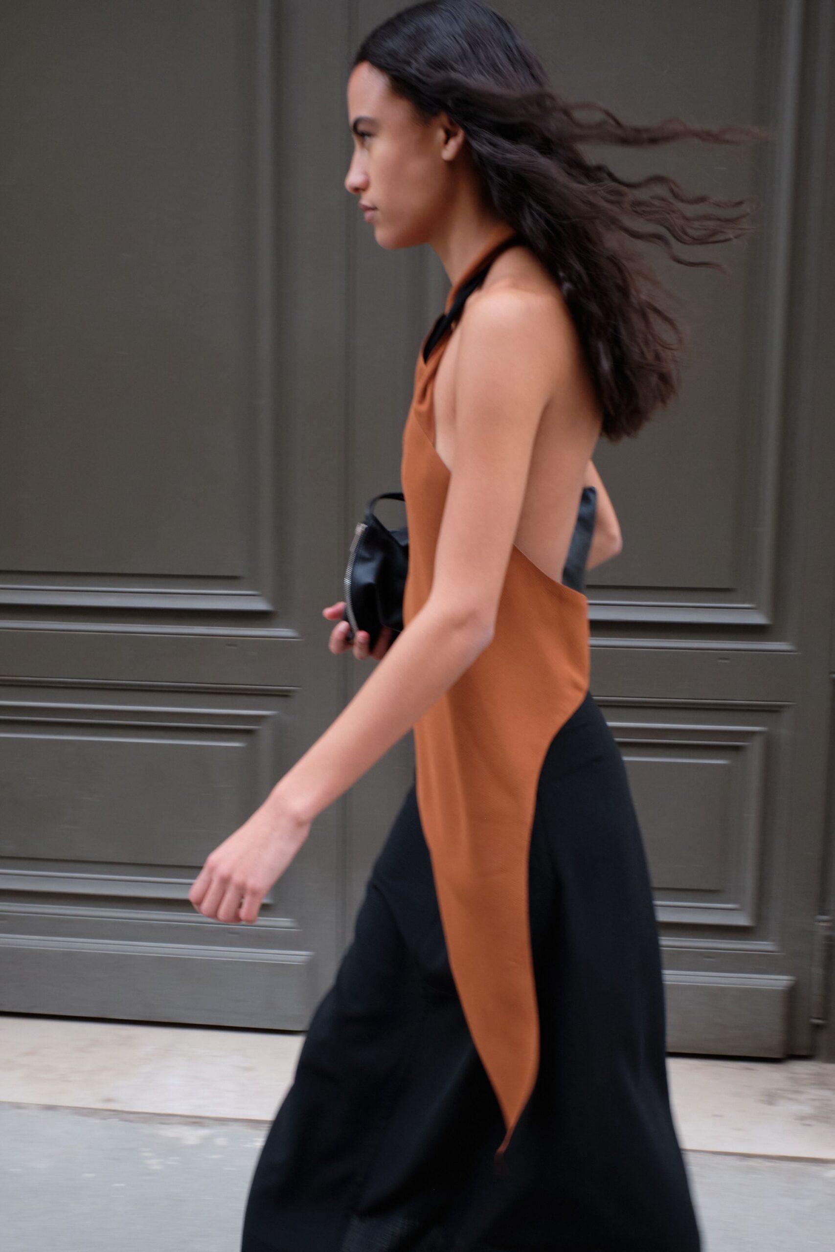 brown asymmetric dress with black bag