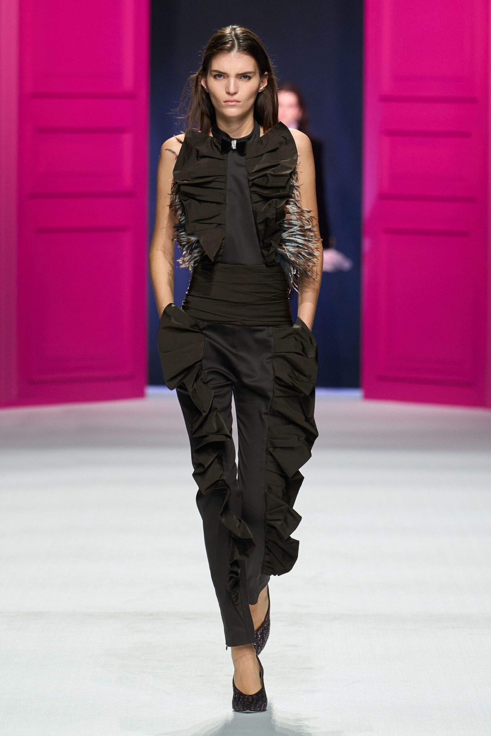 black ruffled jumpsuit with textured shoes