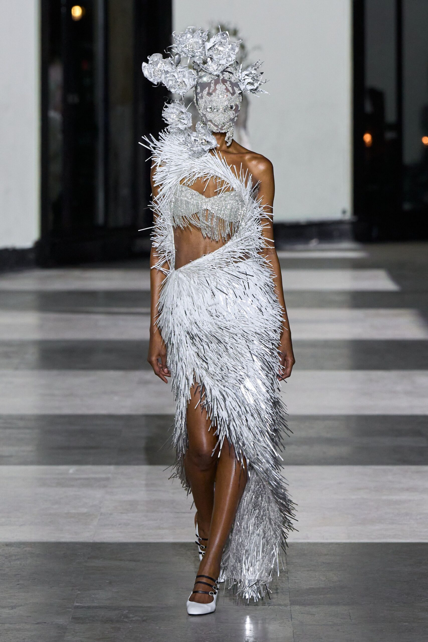 white metallic sleeveless off-shoulder fitted fringed layered gown