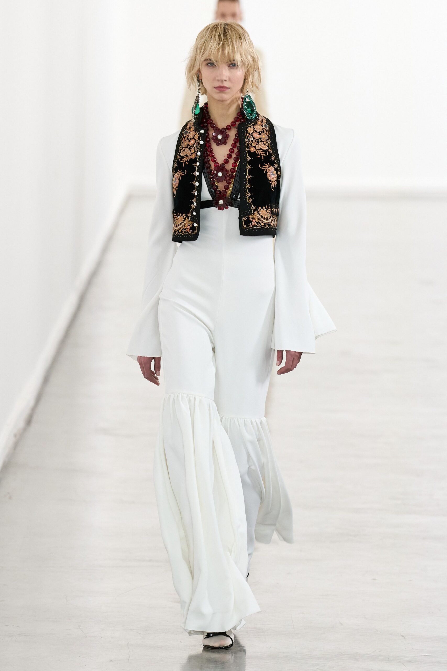 white cotton long-sleeve v-neck fitted flared ruffled jumpsuit
