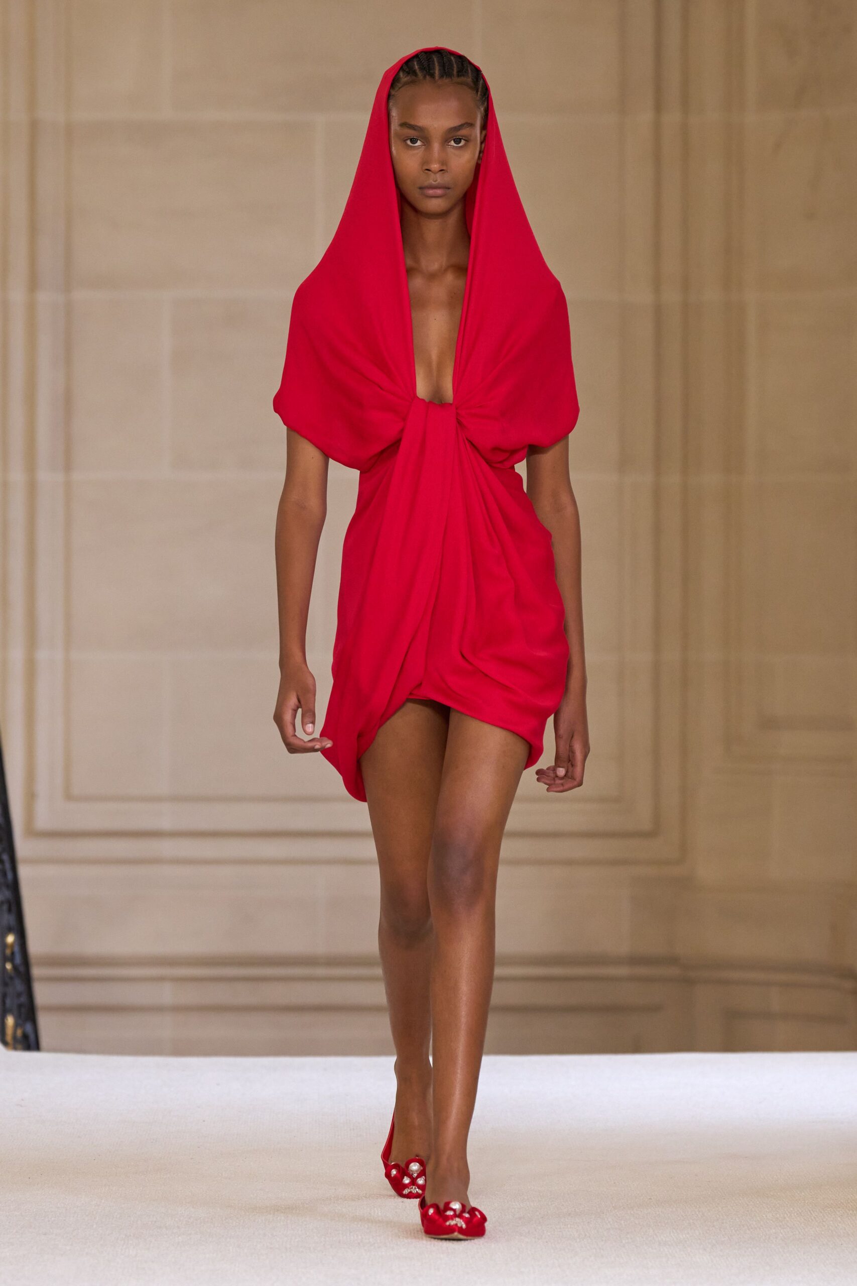 red draped mini dress with embellished shoes