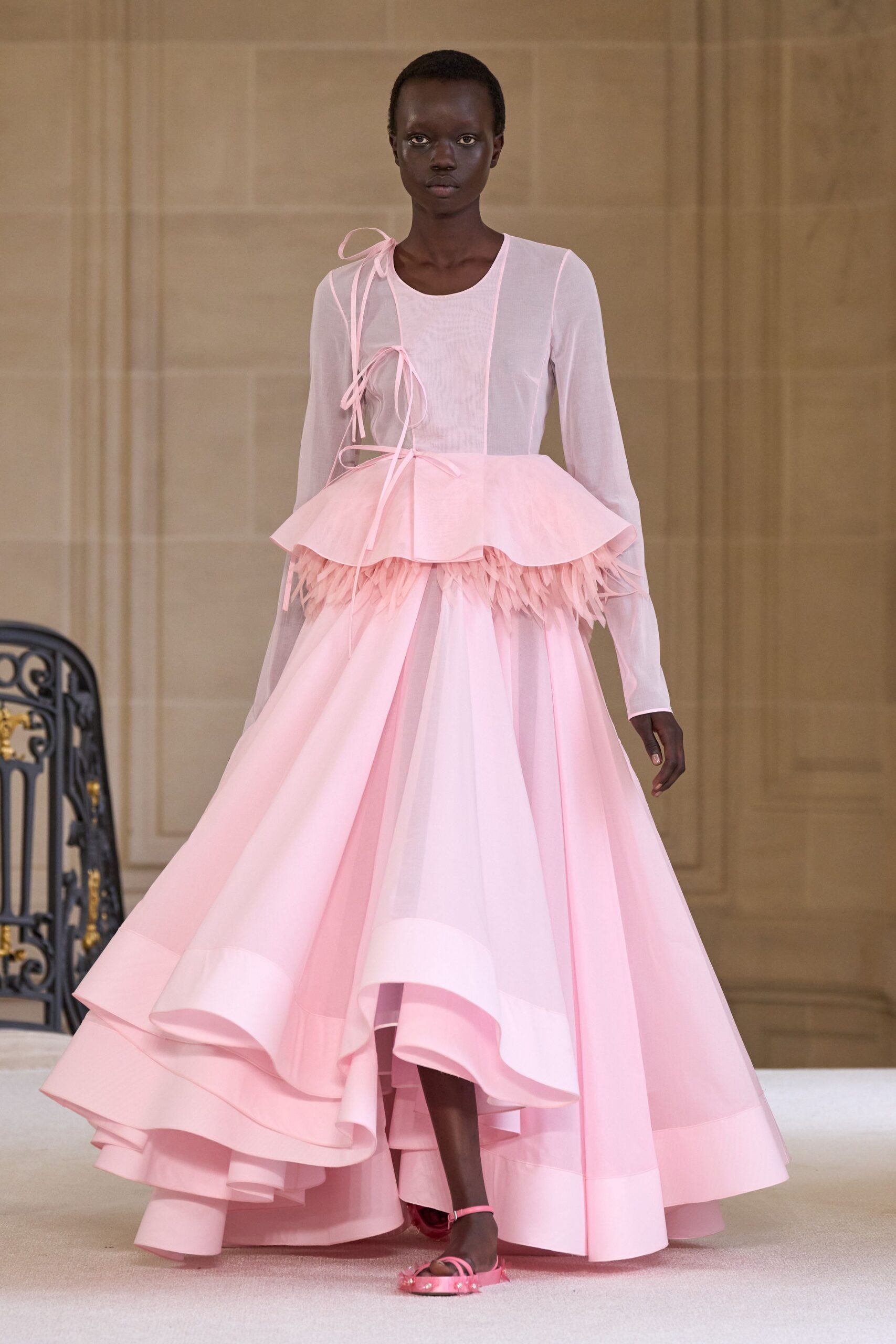 pink silk long-sleeve dress with strappy shoes