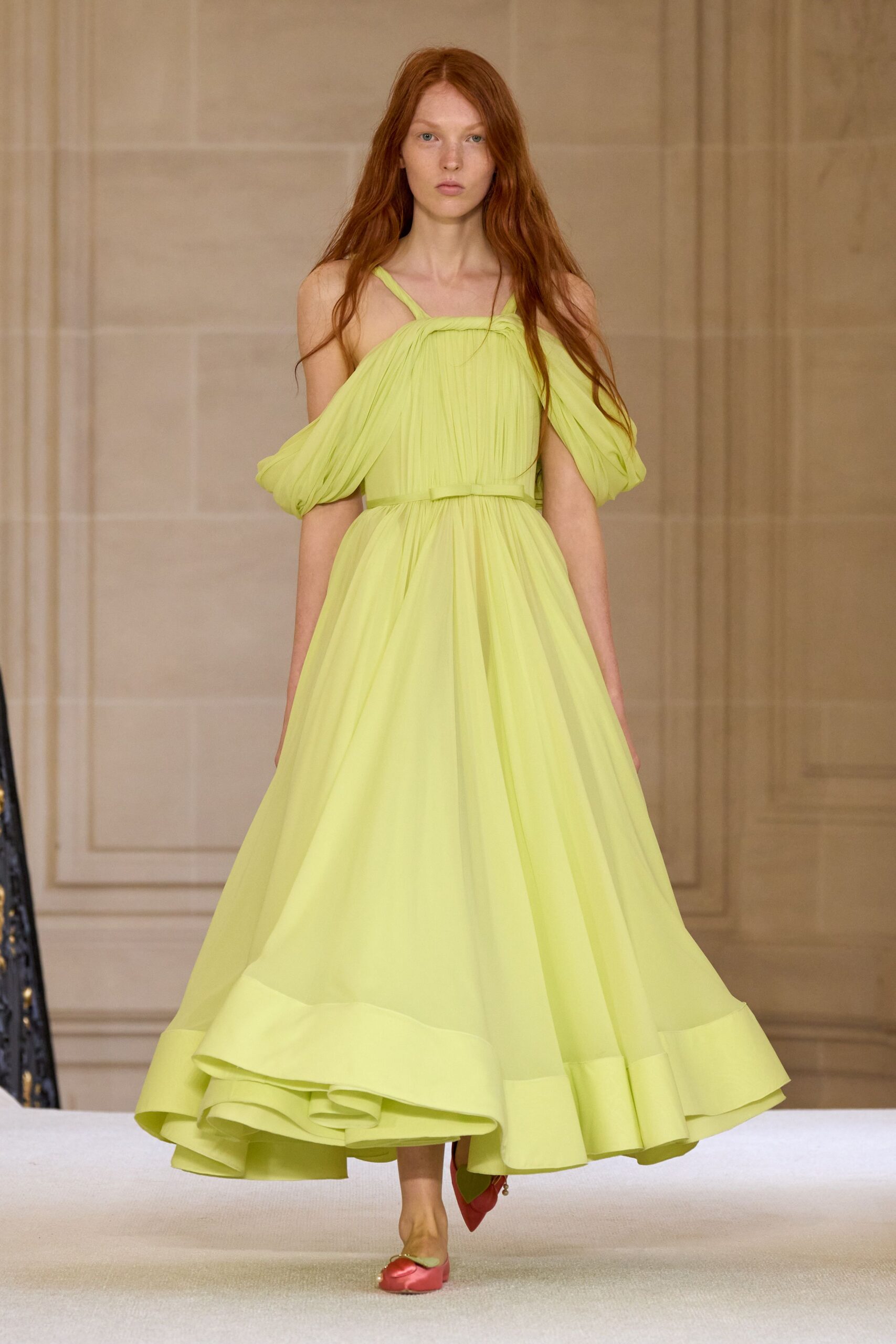 yellow silk off-shoulder gown with red shoes