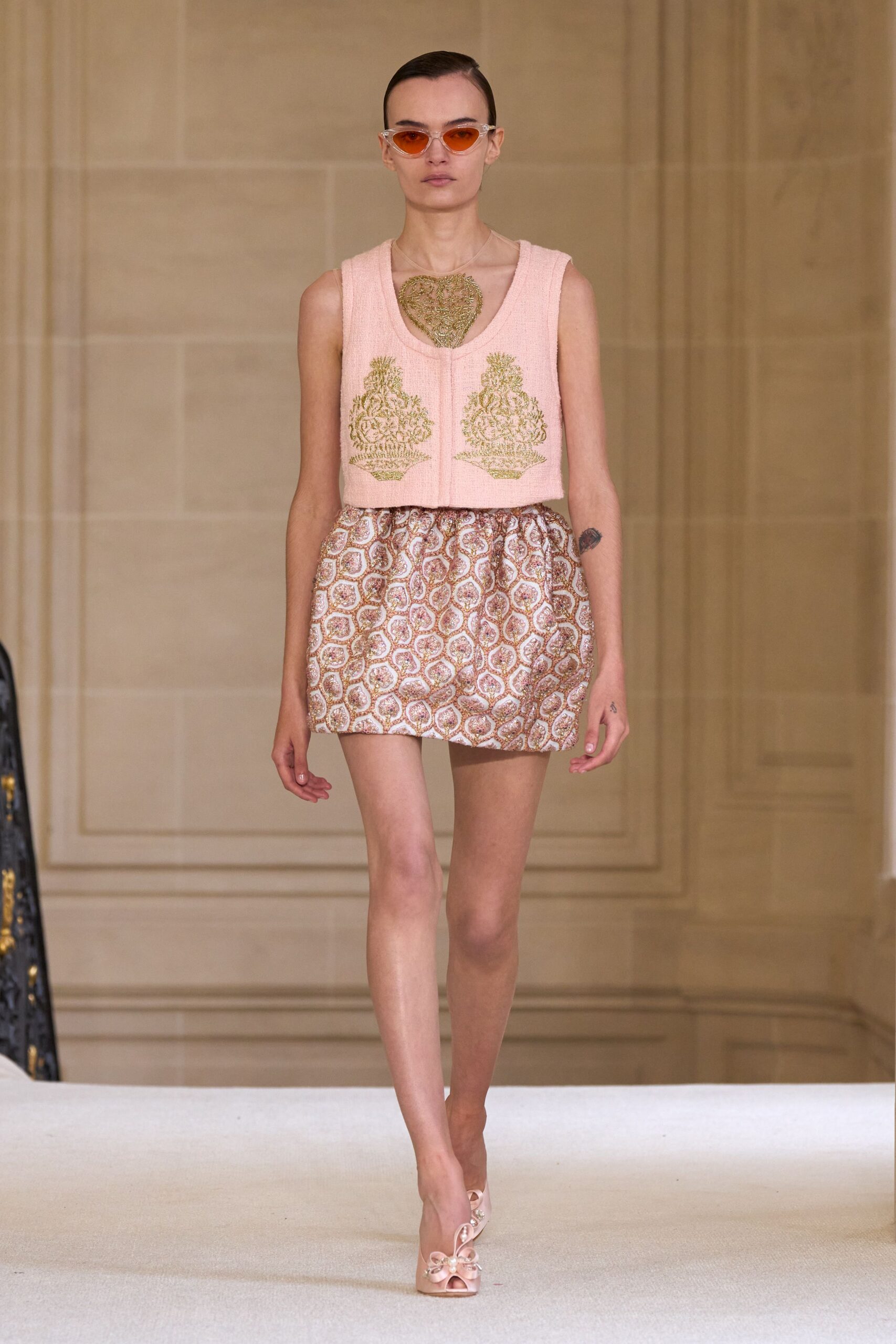 pink embroidered top with mini skirt
