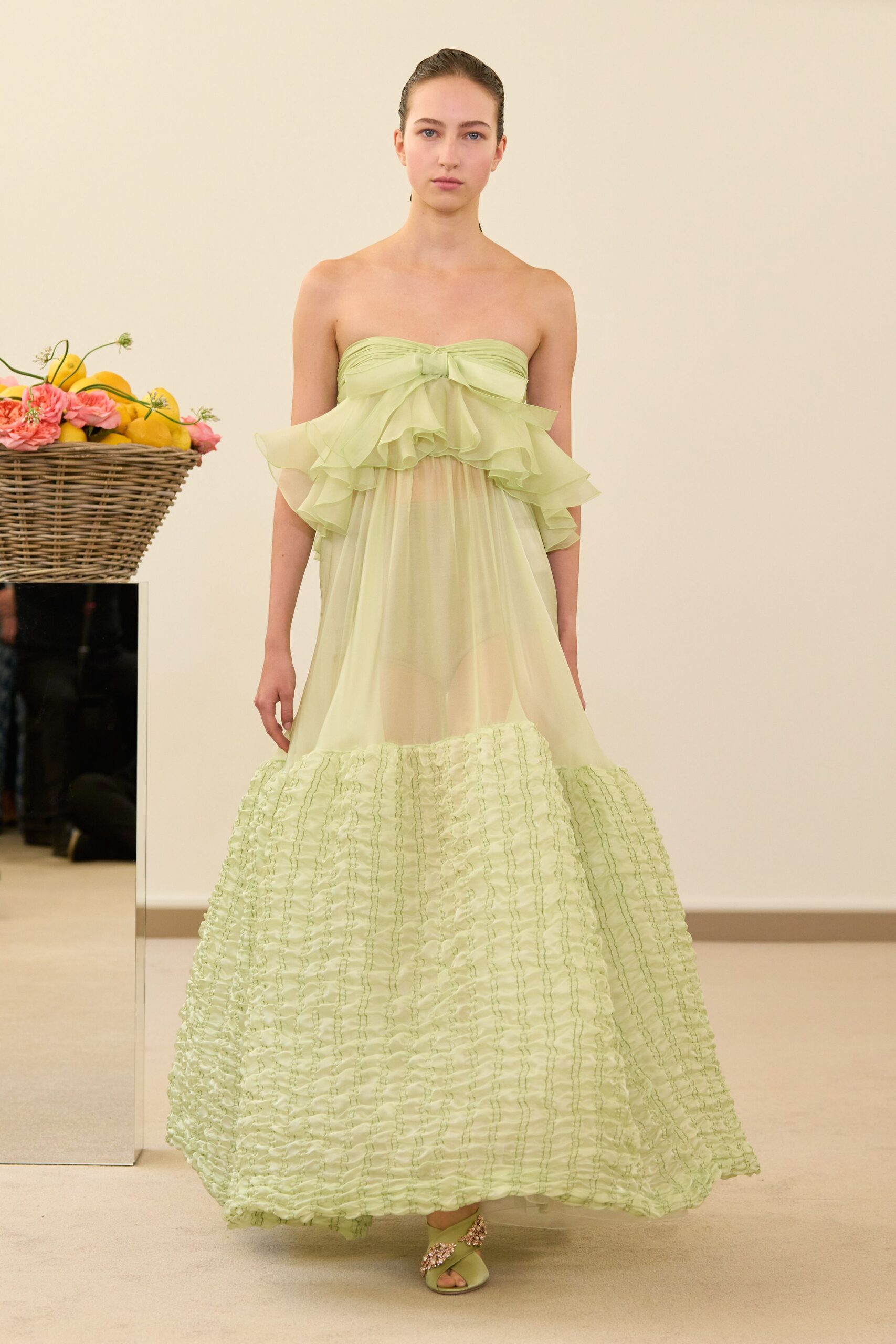 green chiffon strapless fitted ruffled tiered flowing gown