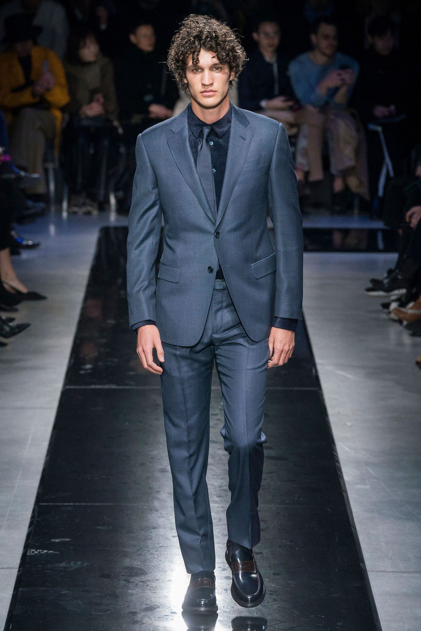 blue tailored suit with black shirt