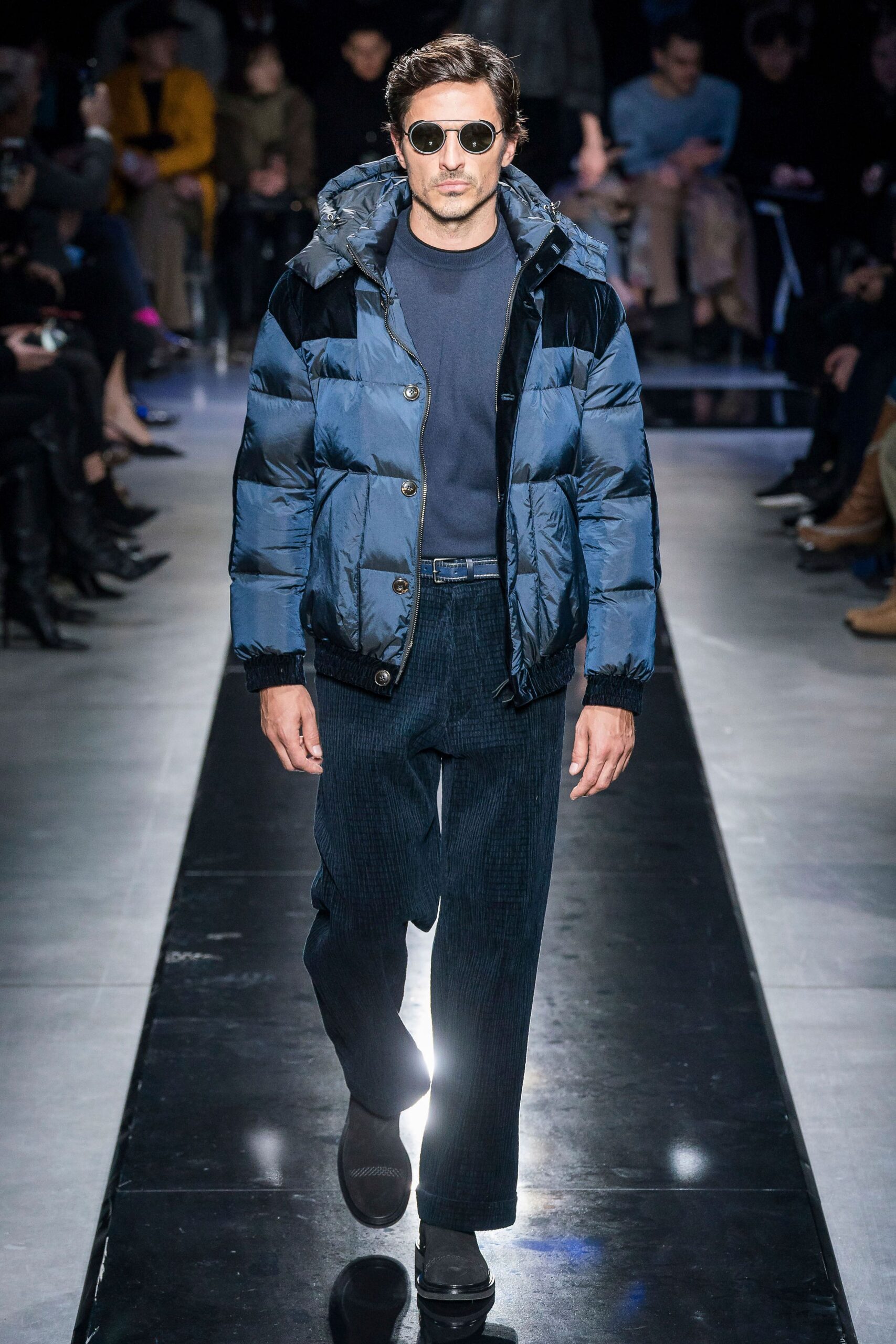 blue nylon jacket with black shirt