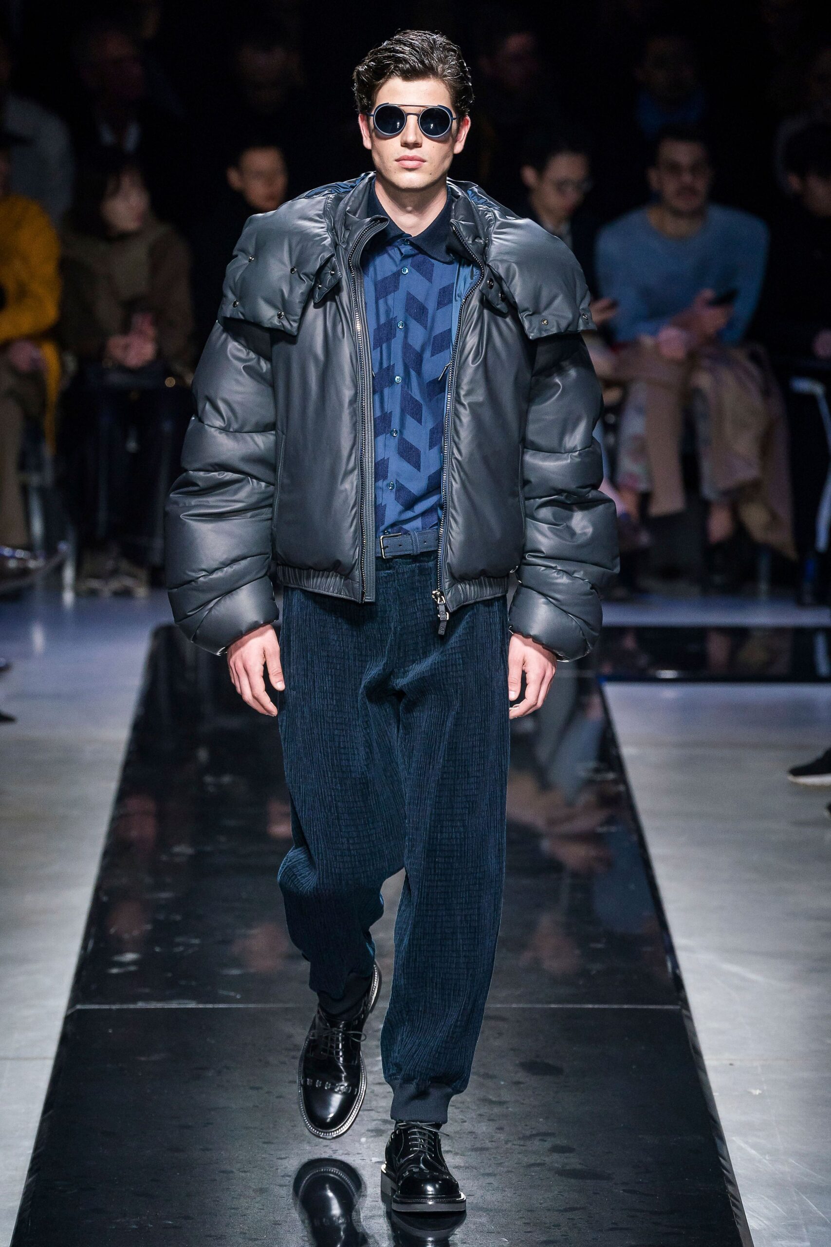 black padded jacket with blue shirt