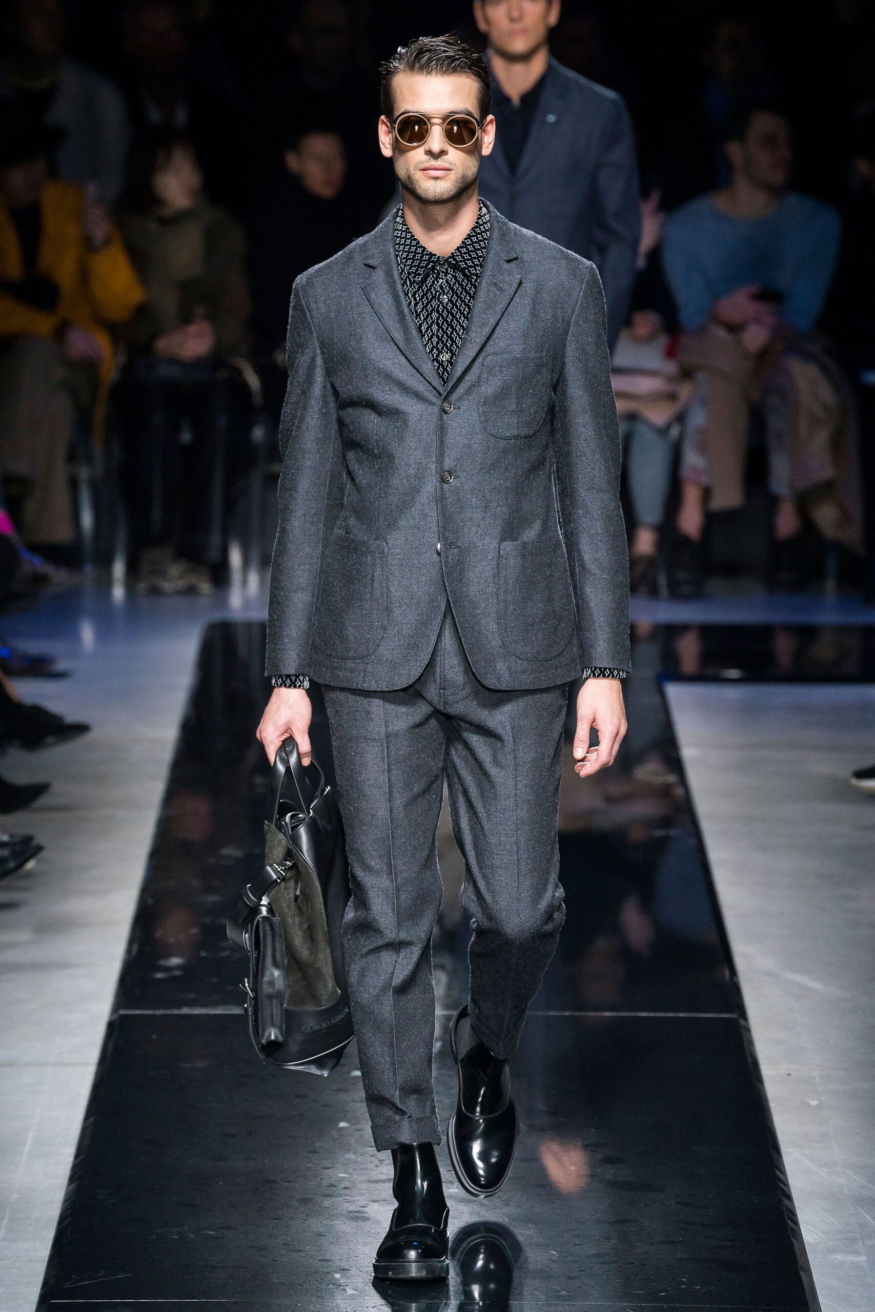 gray tailored suit with black shirt