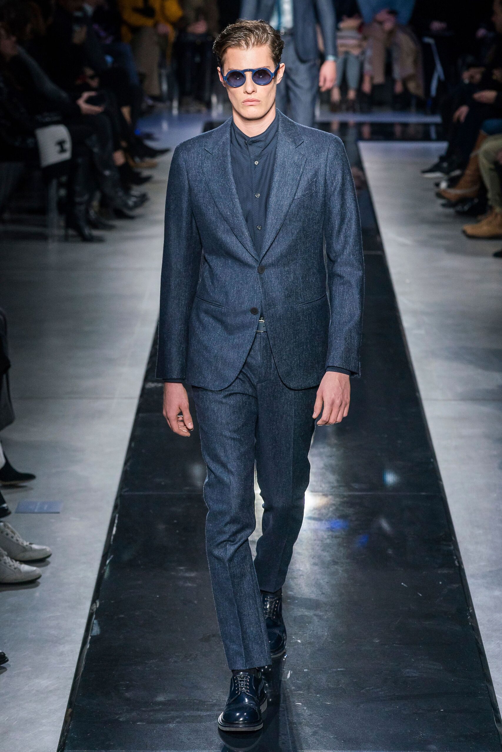 blue tailored suit with sunglasses