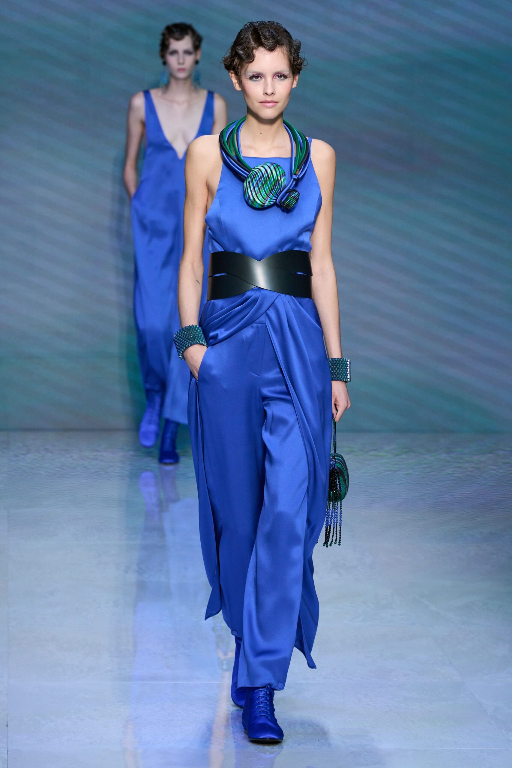 blue satin sleeveless v-neck fitted draped flowing gown