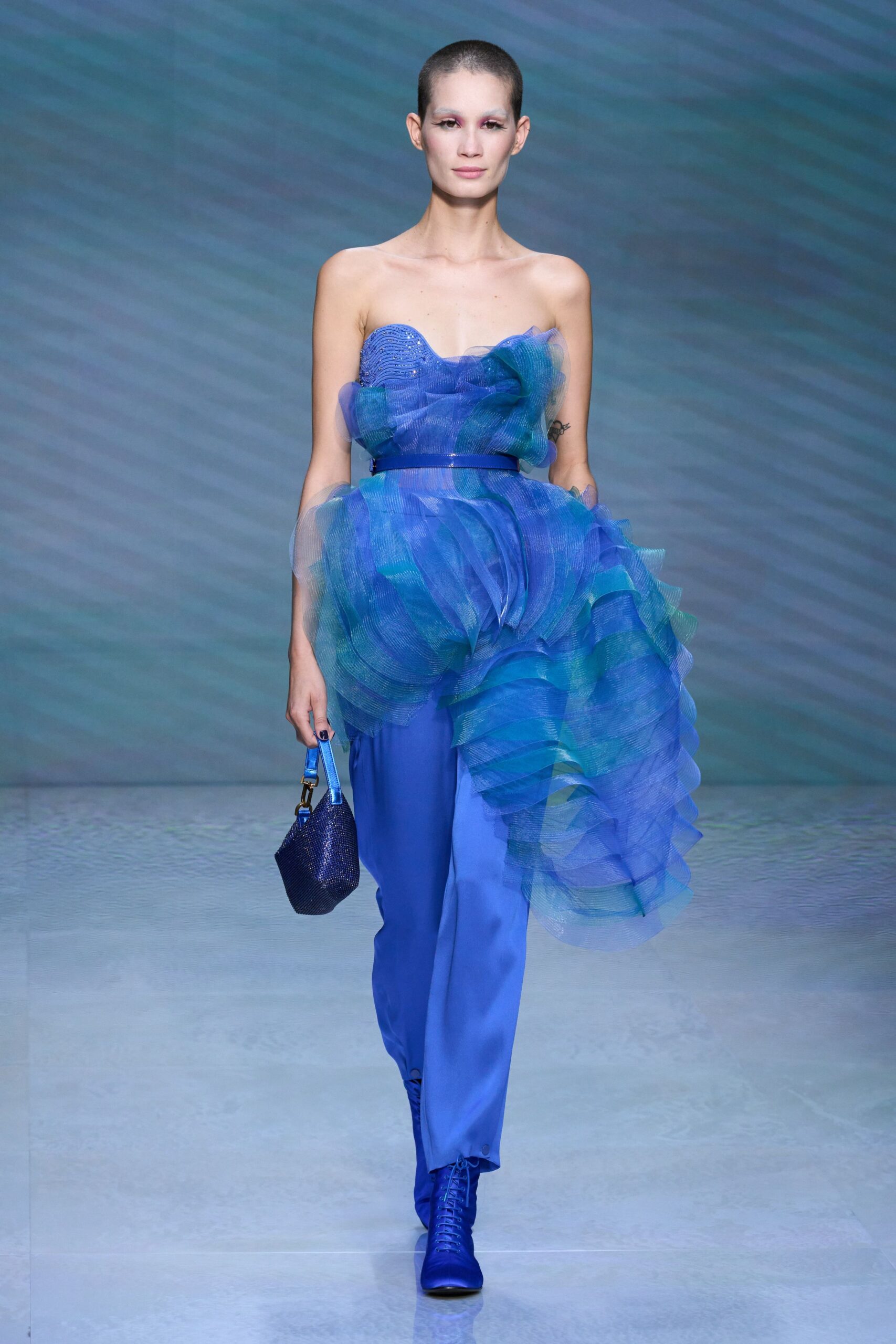 blue silk strapless fitted ruffled layered flowing dress