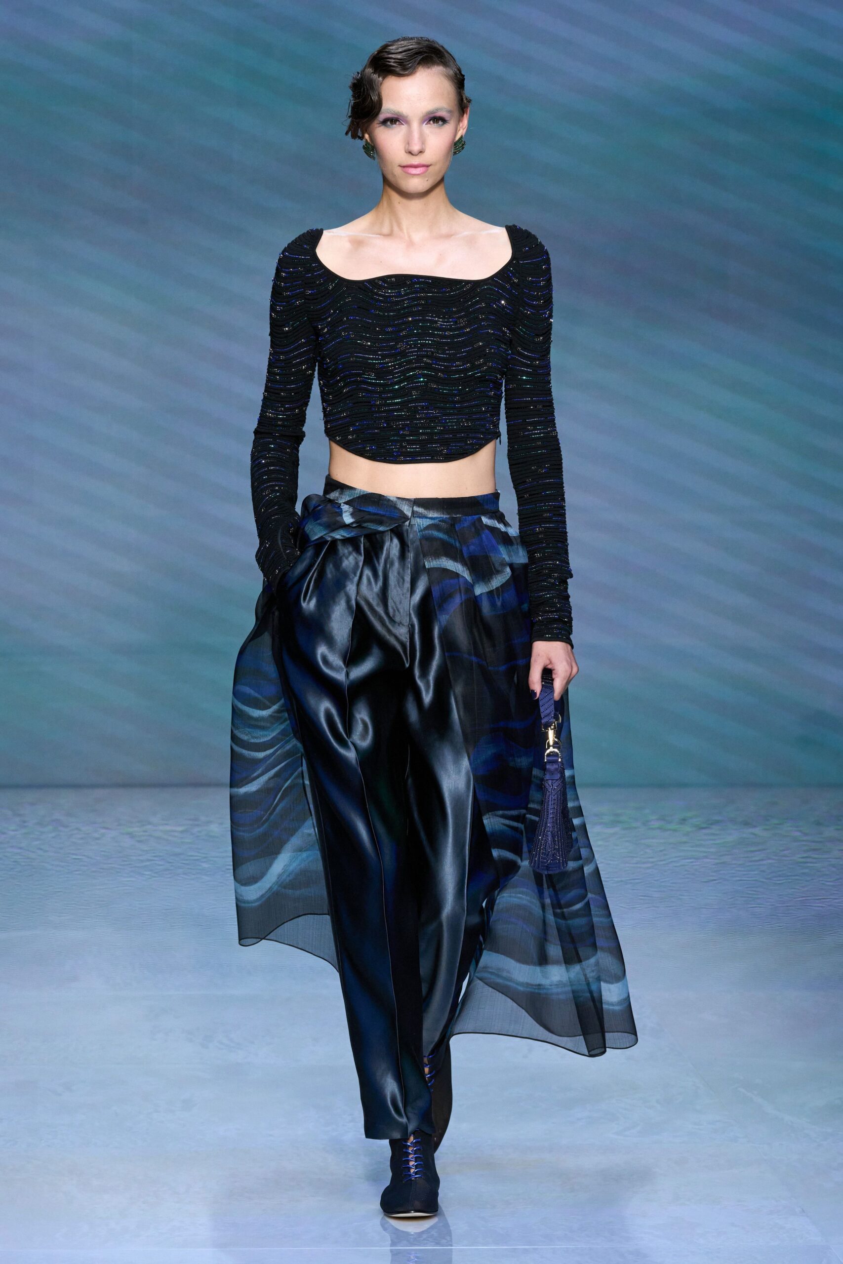 black fitted cropped top with blue wide-leg pants