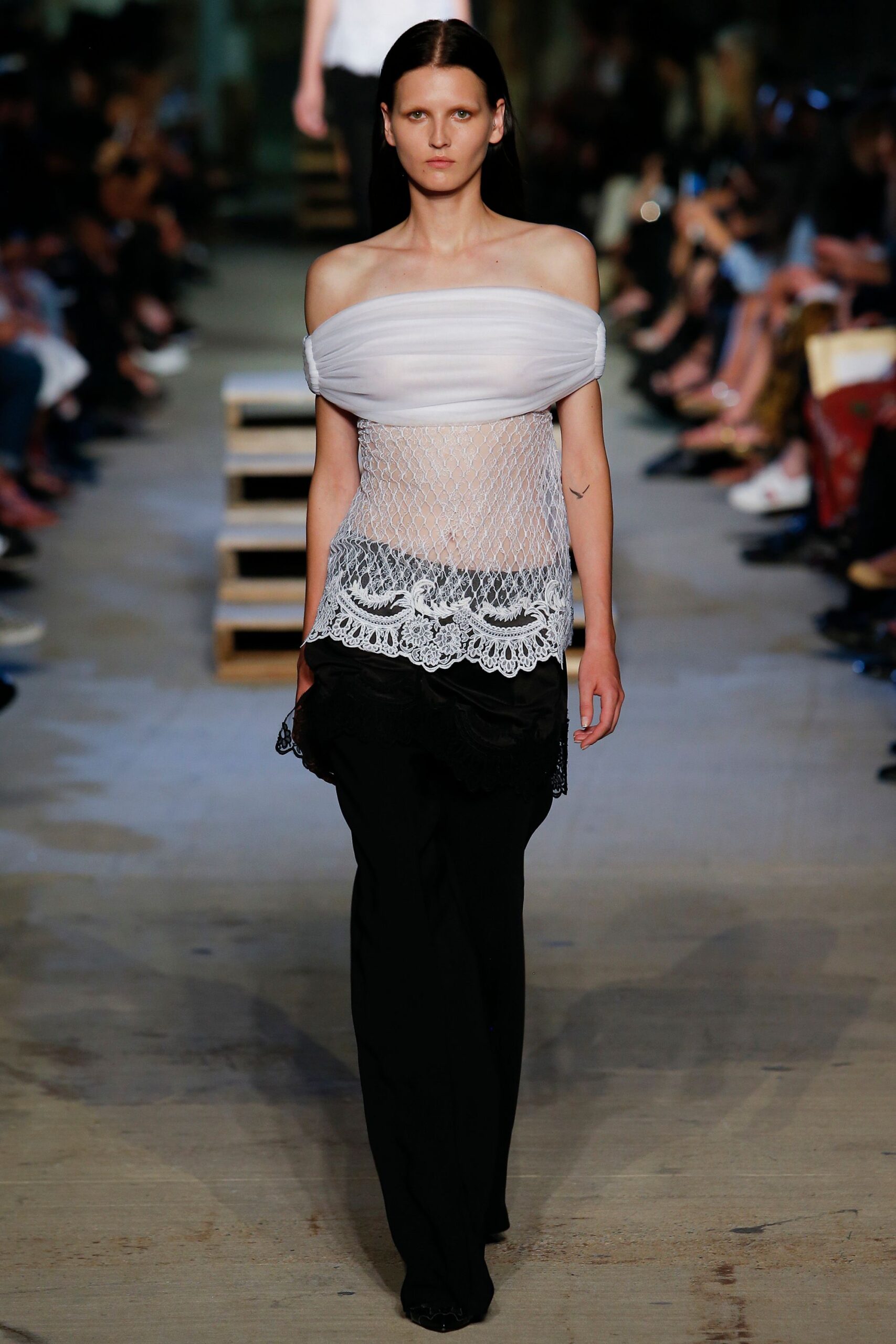 white mesh off-shoulder top with black pants