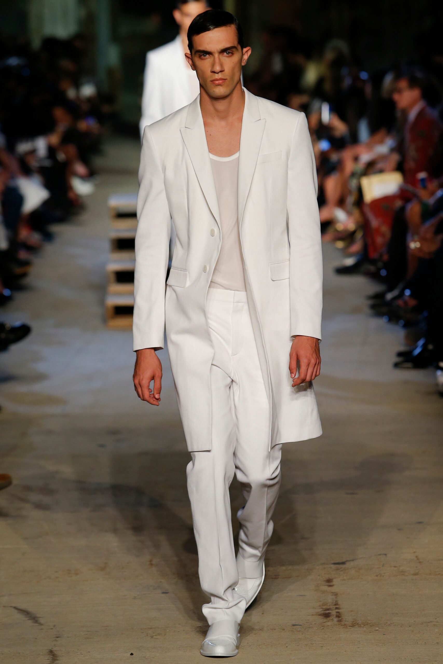 white tailored suit with sleeveless shirt
