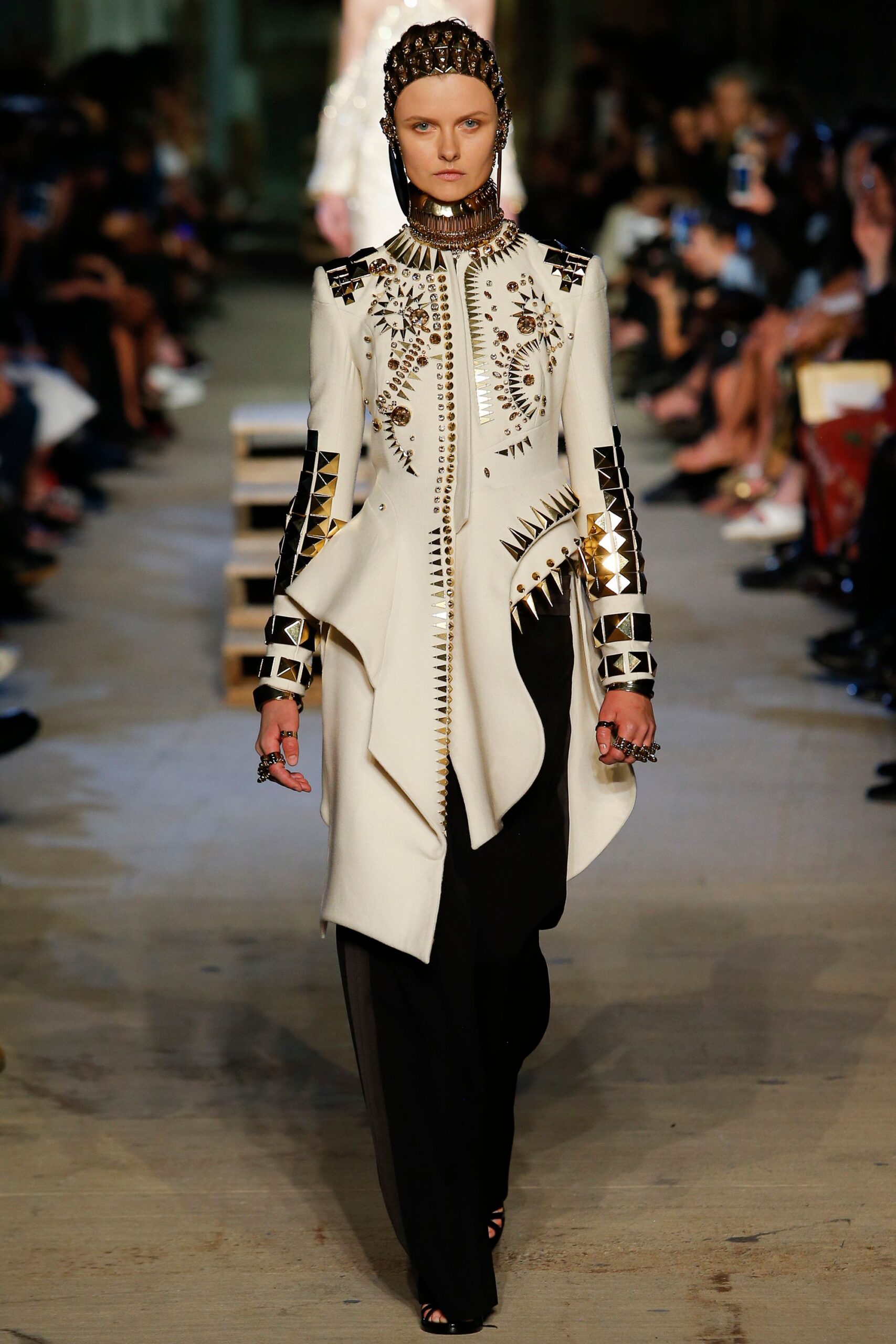 white embroidered coat with black pants