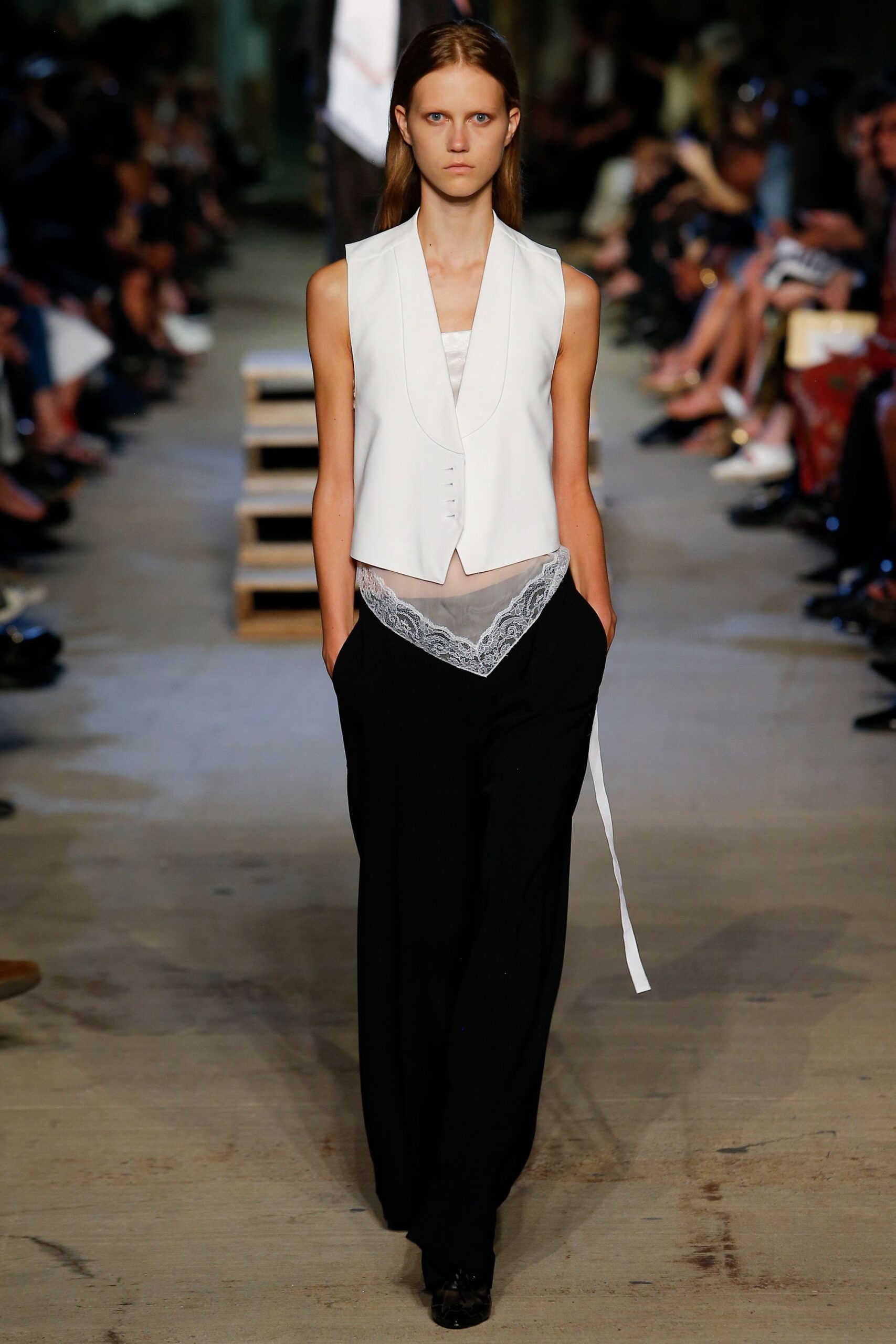 white fitted vest with black pants