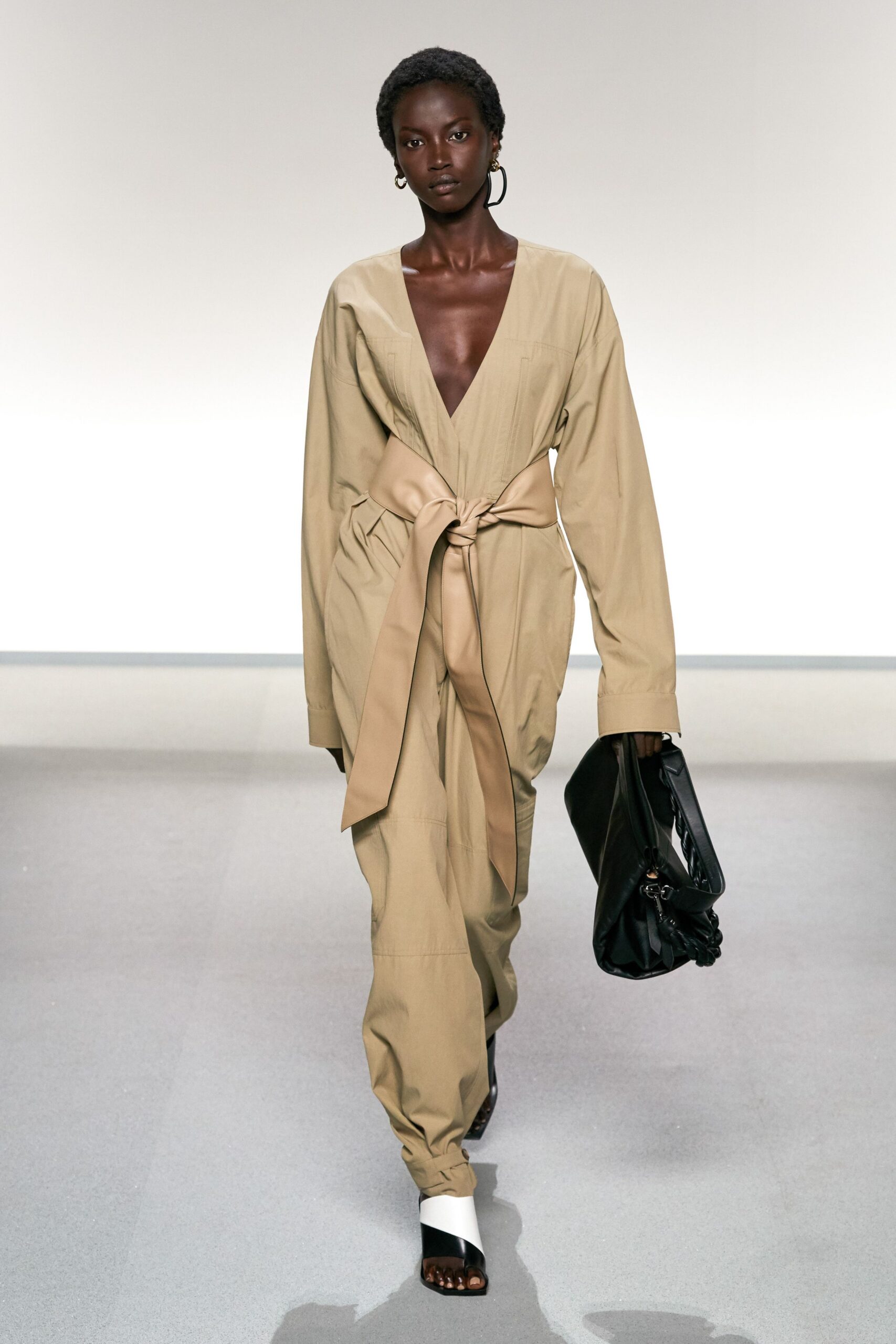 beige cotton long-sleeve v-neck relaxed belted jumpsuit