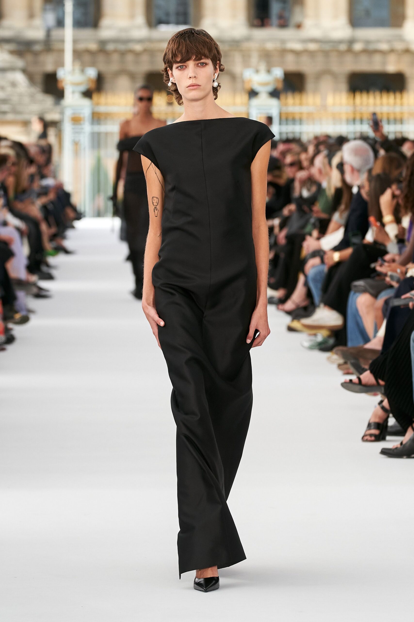 black silk sleeveless high-neck fitted straight-leg jumpsuit