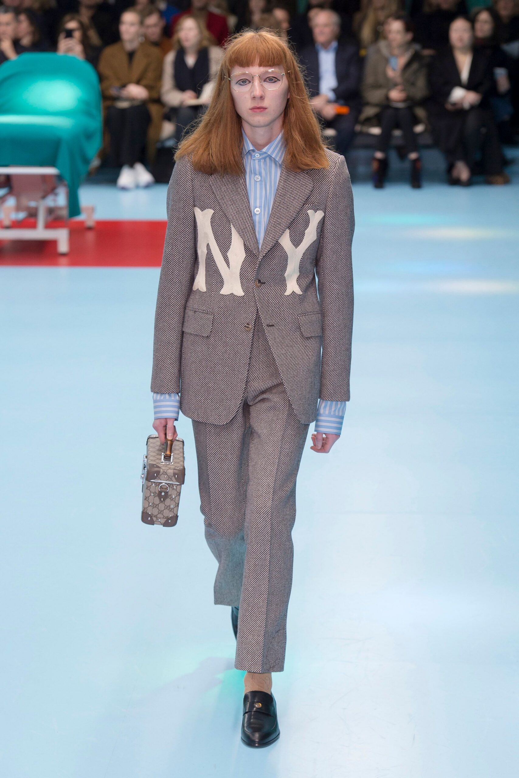 gray tailored suit with blue shirt