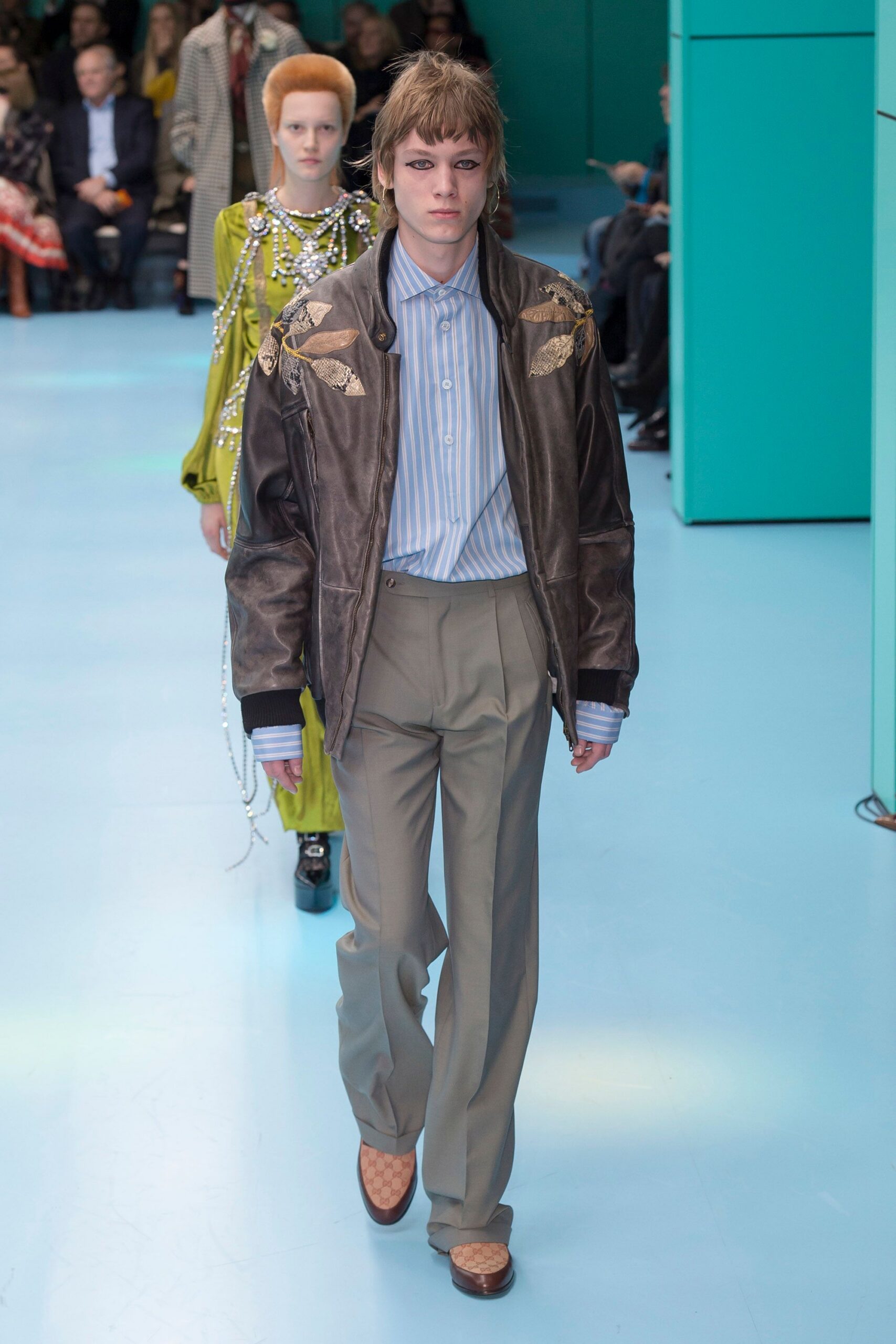brown leather jacket with blue shirt