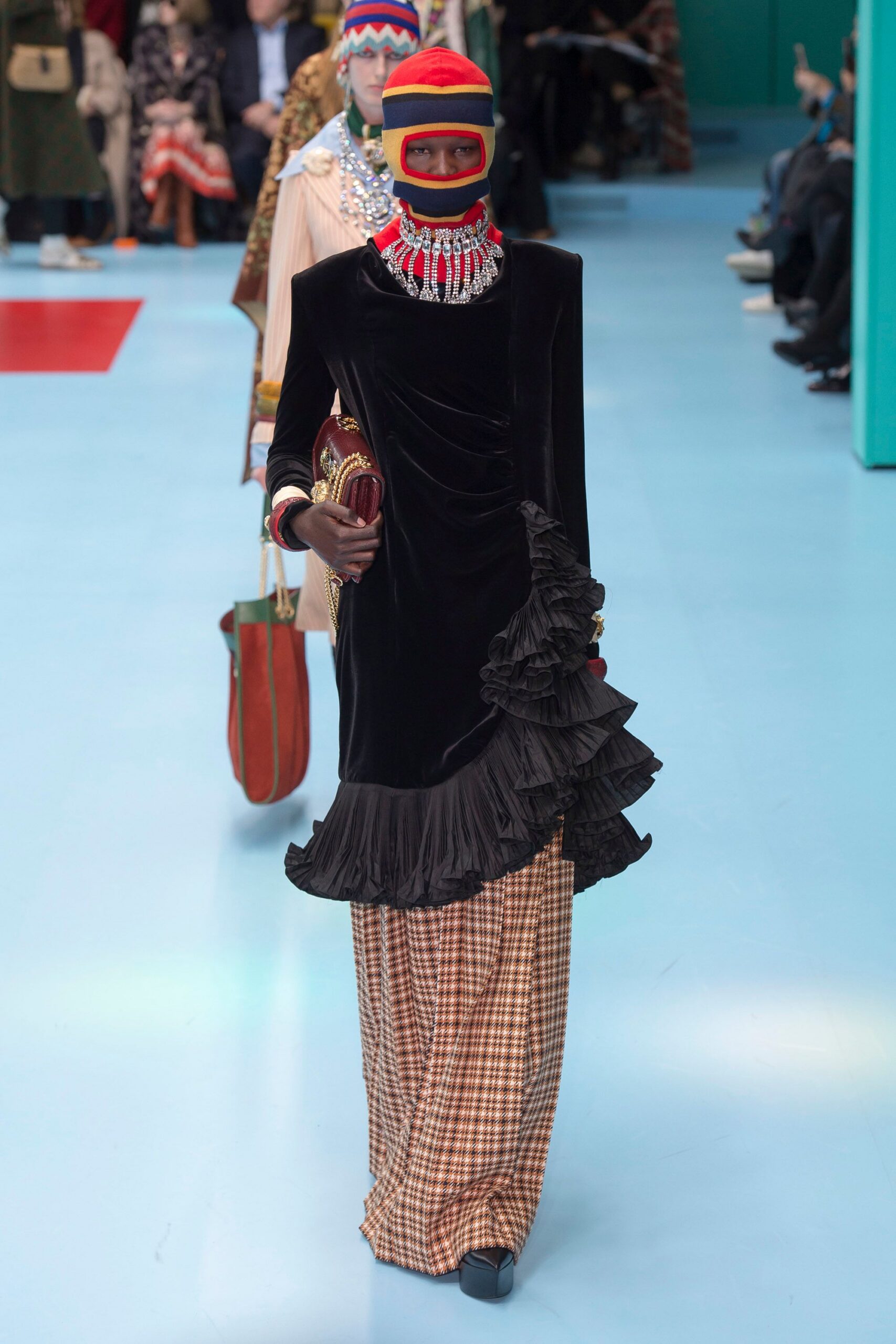 black velvet ruffled dress with checked pants
